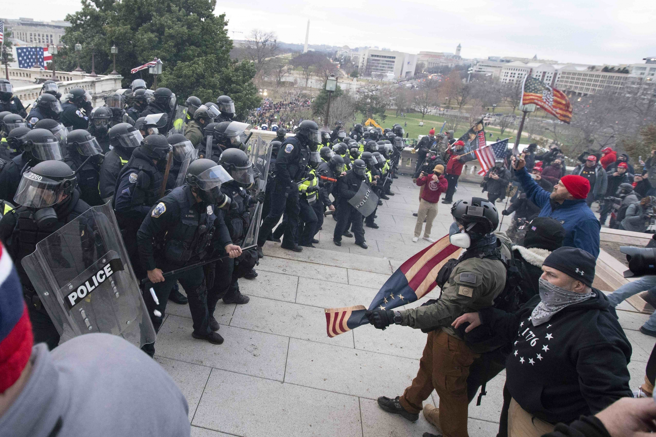 US Capitol Police push back rioters who were trying to enter the US Capitol on Wednesday, Jan. 6, 2021, in Washington, DC. US Capitol Police push back rioters who were trying to enter the US Capitol on Wednesday, Jan. 6, 2021, in Washington, DC.