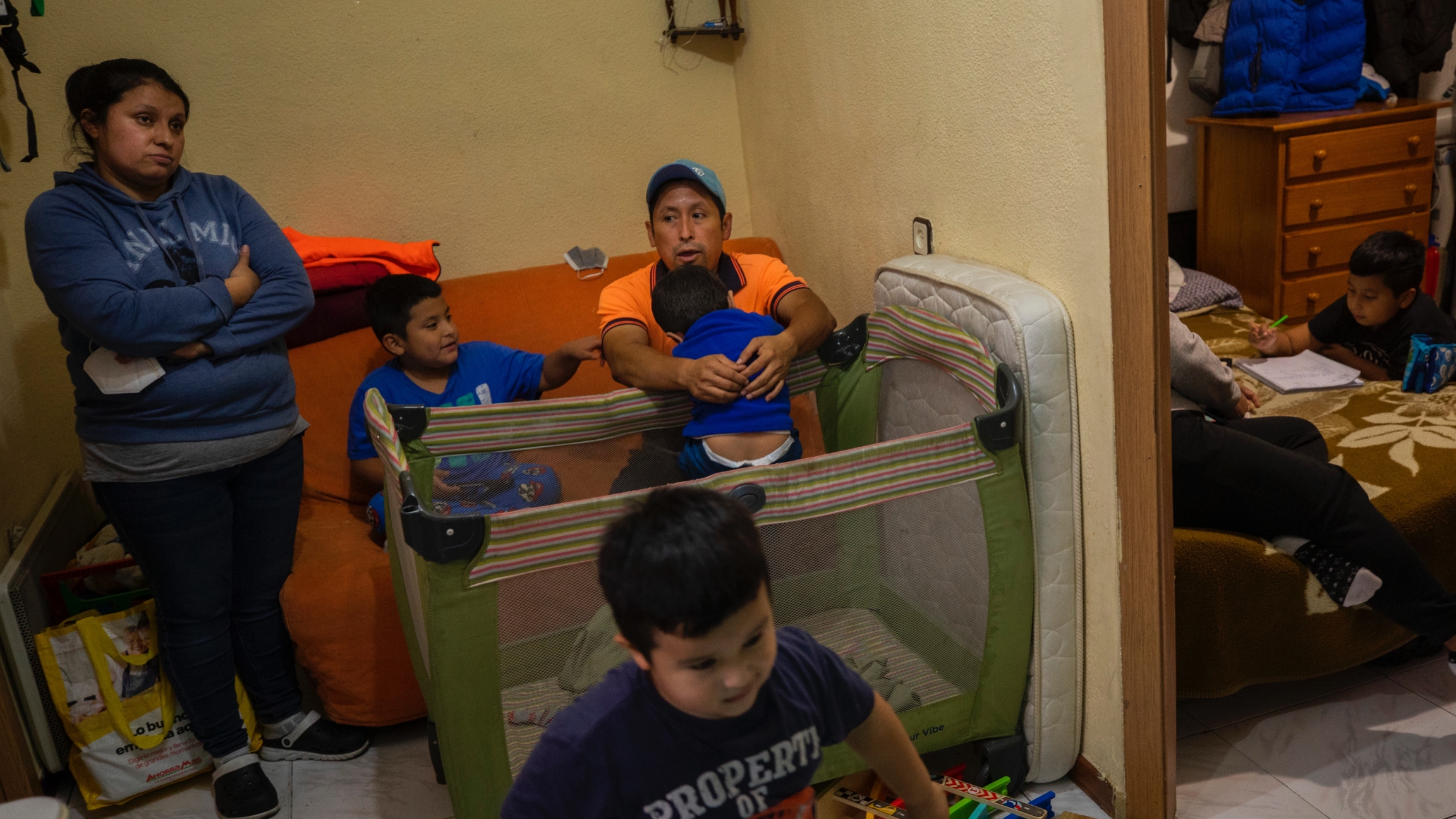 Erika Oliva, left, and her husband Benjamin Lopez's family gather inside their apartment in the southern neighborhood of Vallecas, in Madrid, Spain, Oct. 15, 2020. Erika Oliva, left, and her husband Benjamin Lopez's family gather inside their apartment in the southern neighborhood of Vallecas, in Madrid, Spain, Oct. 15, 2020.