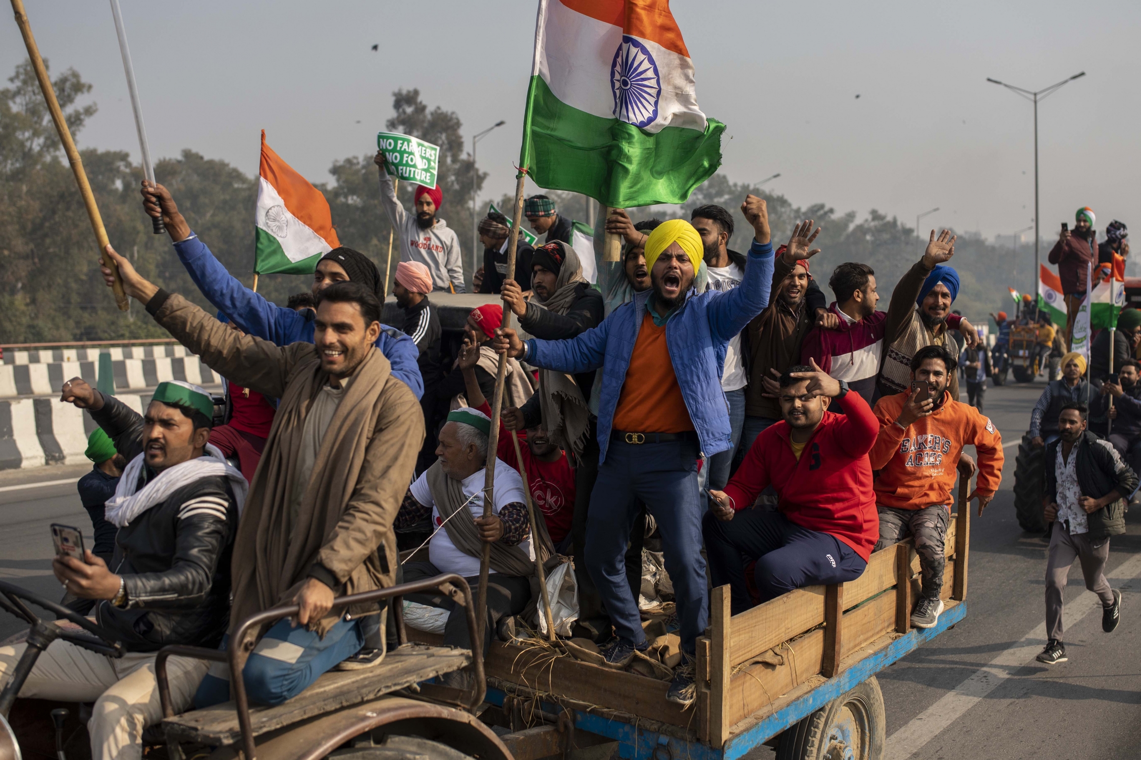 Tens of thousands of farmers drove a convoy of tractors into the Indian capital as the nation celebrated Republic Day on Tuesday in the backdrop of agricultural protests that have grown into a rebellion and rattled the government. Tens of thousands of farmers drove a convoy of tractors into the Indian capital as the nation celebrated Republic Day on Tuesday in the backdrop of agricultural protests that have grown into a rebellion and rattled the government.