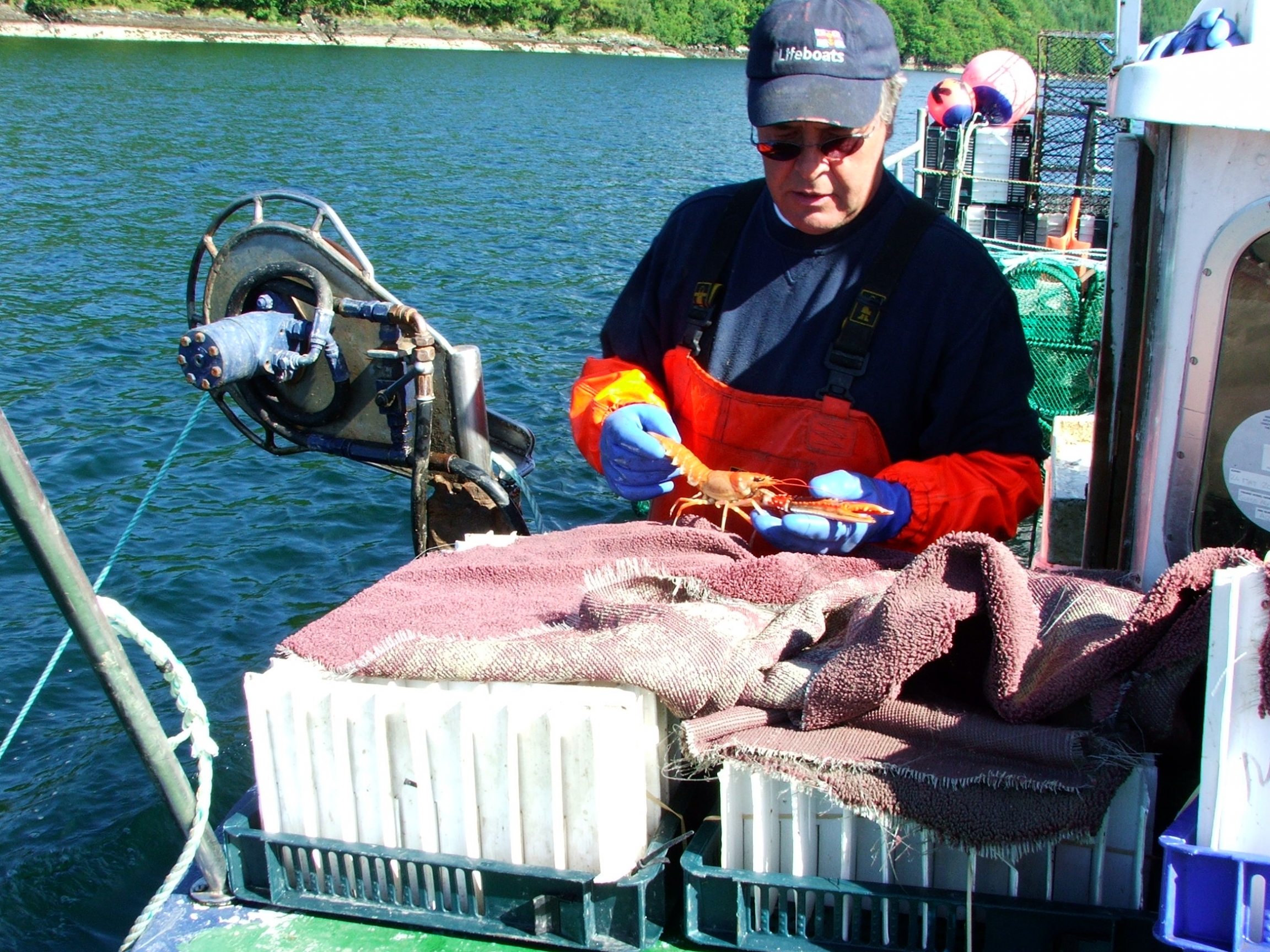 Scottish fisherman Alistair Sinclair hasn't taken his boat — called Guess Again — out since the pandemic began. Scottish fisherman Alistair Sinclair hasn't taken his boat — called Guess Again — out since the pandemic began.