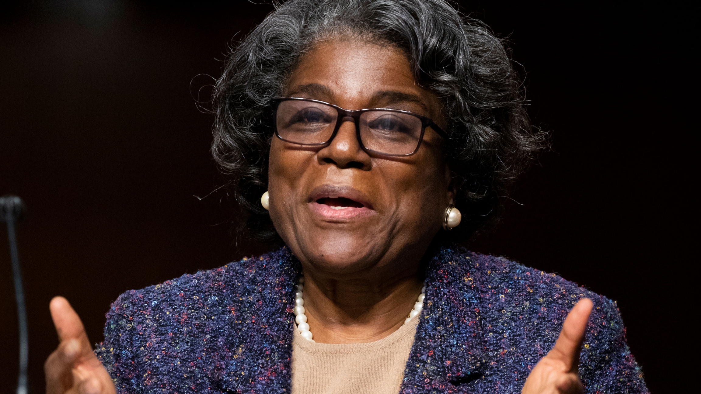 United States Ambassador to the United Nations nominee Linda Thomas-Greenfield testifies during for her confirmation hearing before the Senate Foreign Relations Committee on Capitol Hill, Jan. 27, 2021. Linda Thomas-Greenfield is shown seated, wearing dark-framed glasses and testifying.