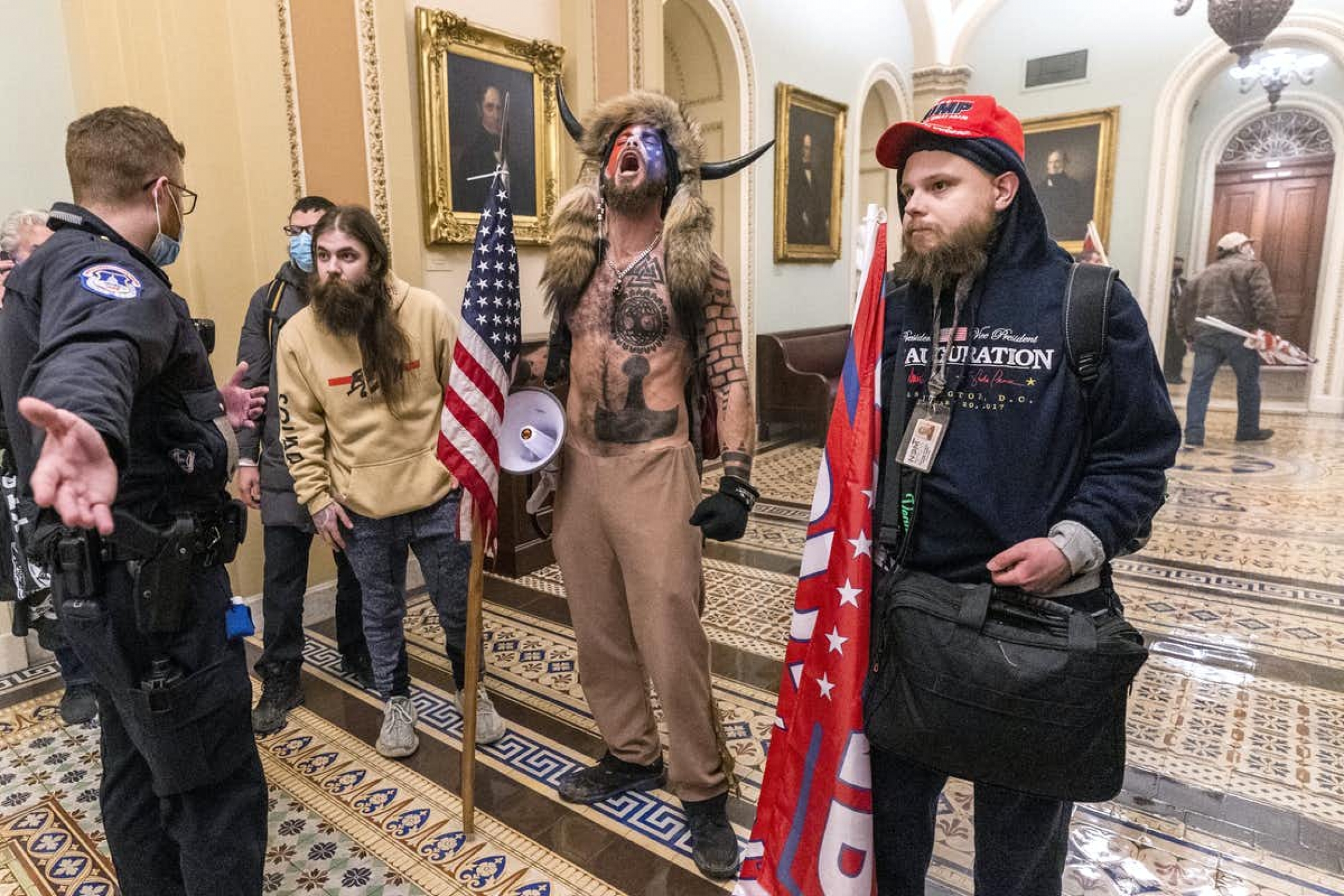 A shirtless man known as the "QAnon Shaman" was one of the high-profile members of Trump supporters who invaded the US Capitol. 