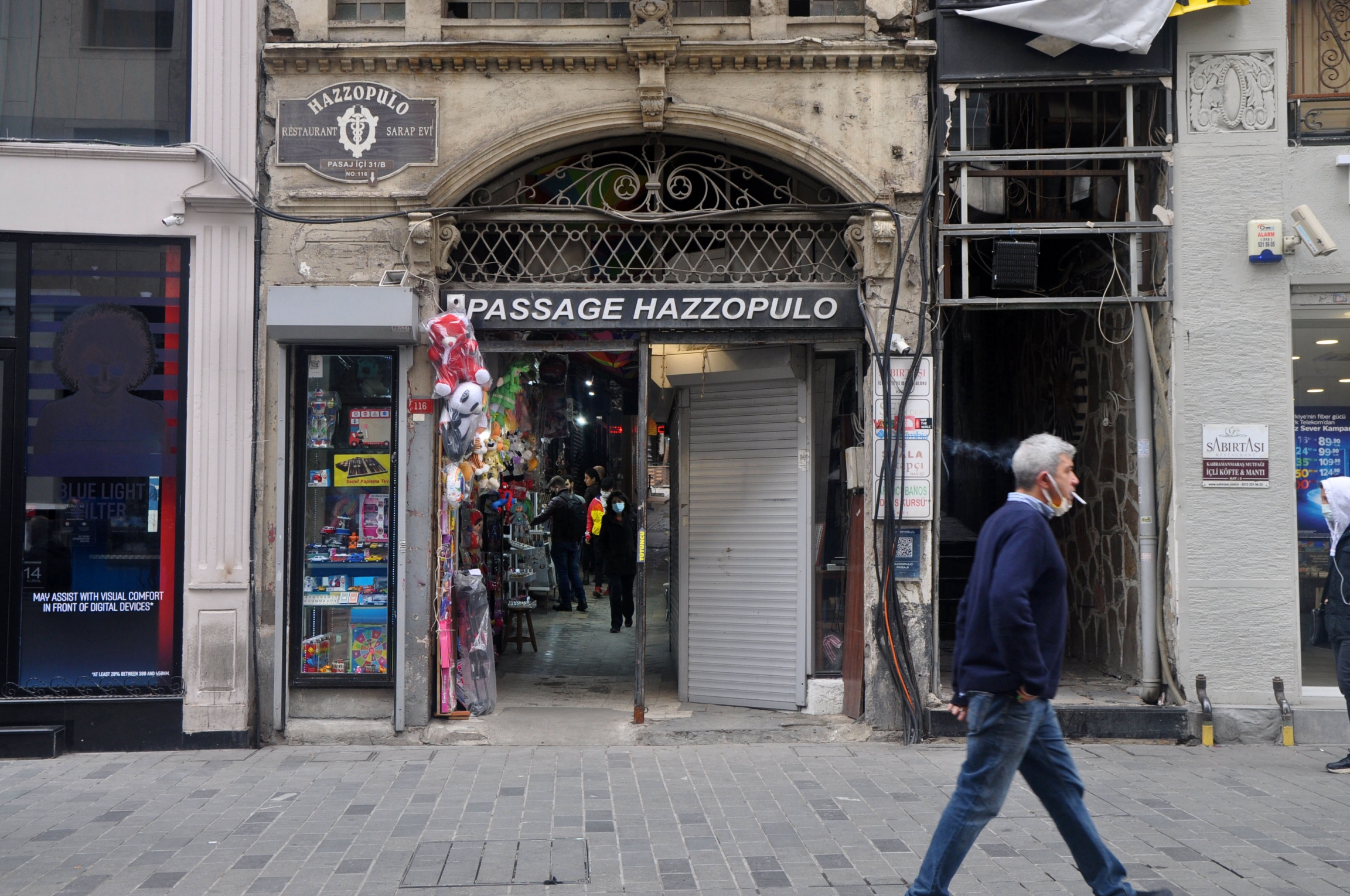 Situated just off of the bustling Istiklal Avenue in Istanbul’s Beyoğlu district, the Hazzopulo Passage is one of several alleyways that can elude passersby. A tunnel of shops and jewelers opens into a courtyard tea garden like a breath of fresh air. From A entranceway to a tunnel in Istanbul.