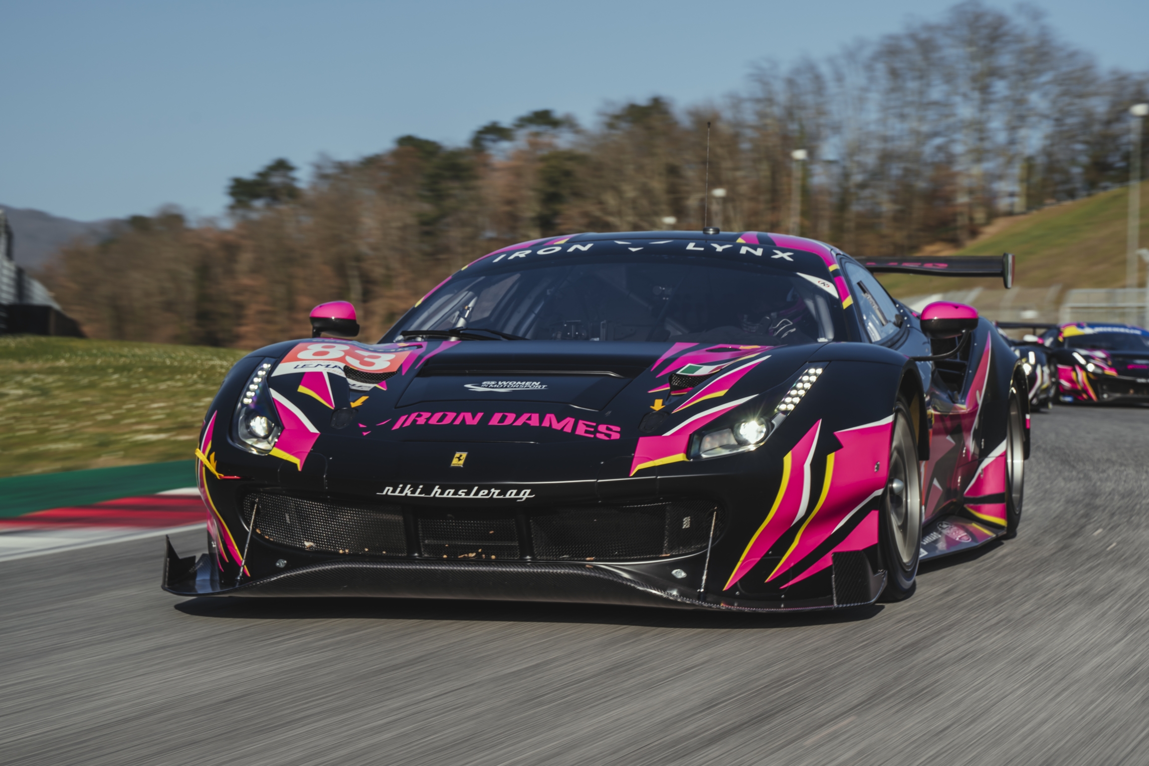 Close up of an Iron Dames race car.