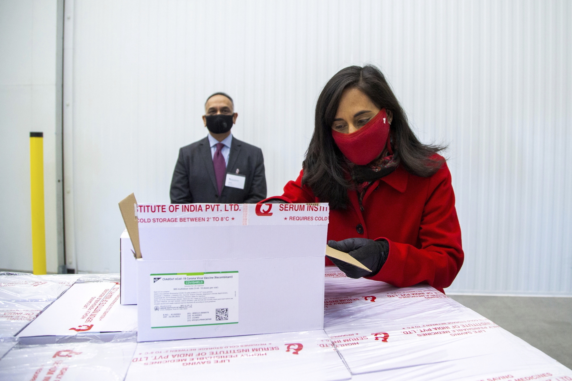 Anita Anand, Canada's Minister of Public Services and Procurement opens a box with some of the AstraZeneca COVID-19 vaccine doses that Canada has secured through a deal with the Serum Institute of India in partnership with Verity Pharma at a facility in M Anita Anand, Canada's Minister of Public Services and Procurement opens a box with some of the AstraZeneca COVID-19 vaccine doses that Canada has secured through a deal with the Serum Institute of India in partnership with Verity Pharma at a facility in M