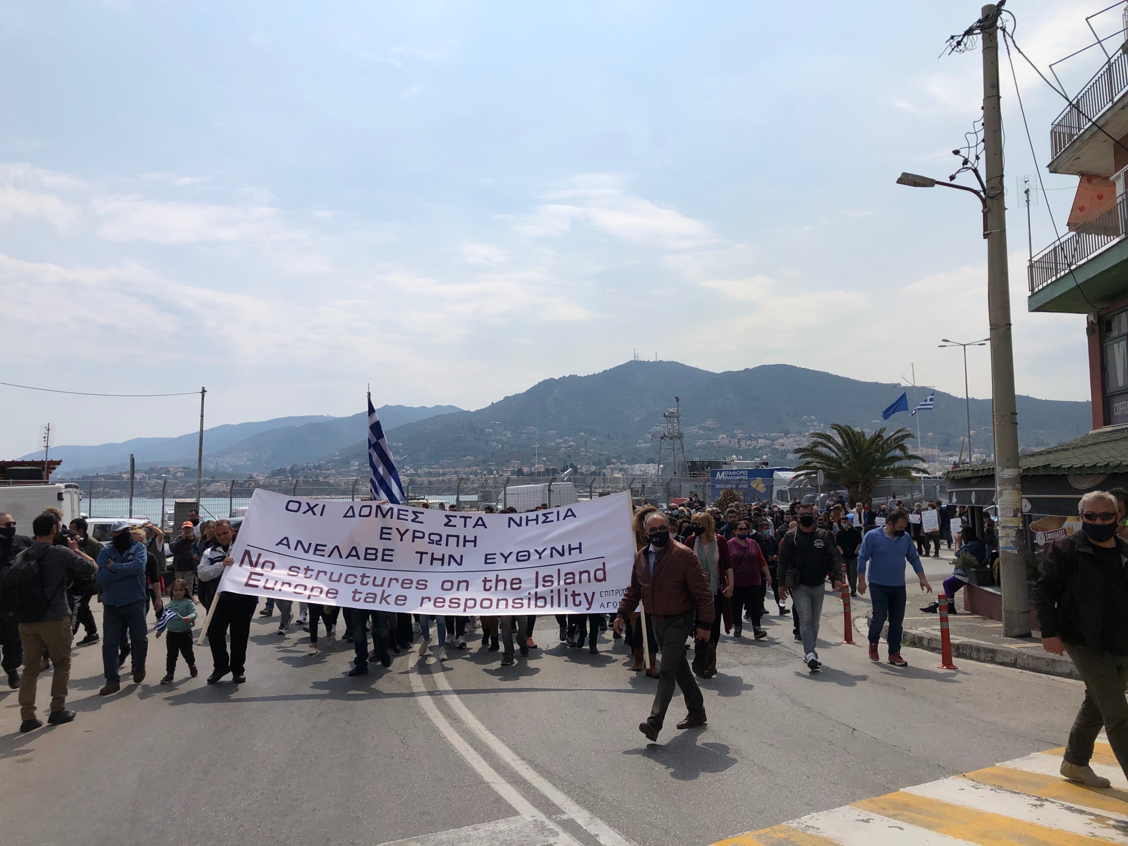 Locals on Lesbos protest the creation of a new migrant facility on the island. Locals on Lesbos protest the creation of a new migrant facility on the island.