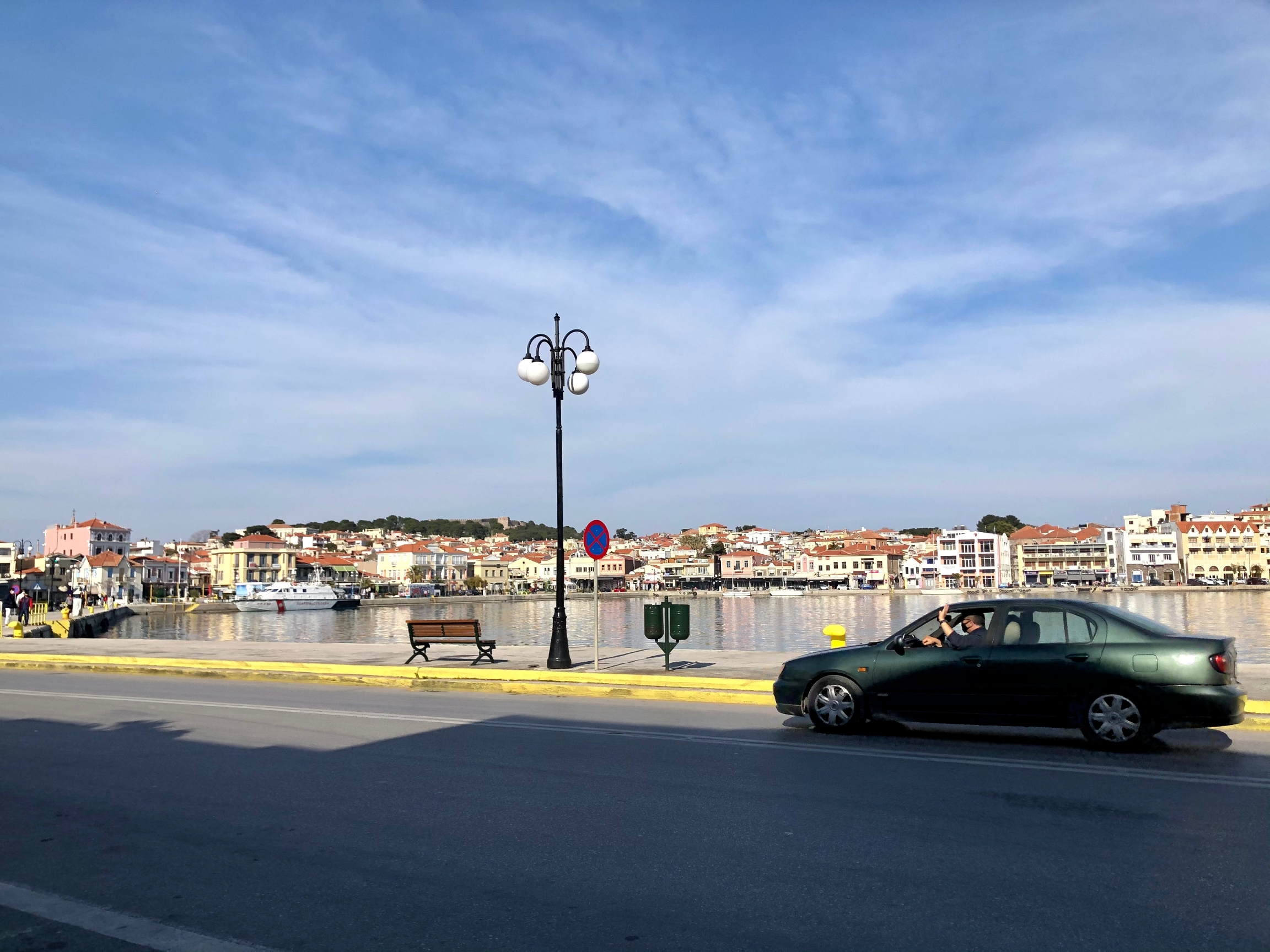 A car drives along the seaside near the port of Mytilene on Lesbos, Greece. A car drives along the seaside near the port of Mytilene on Lesbos, Greece.
