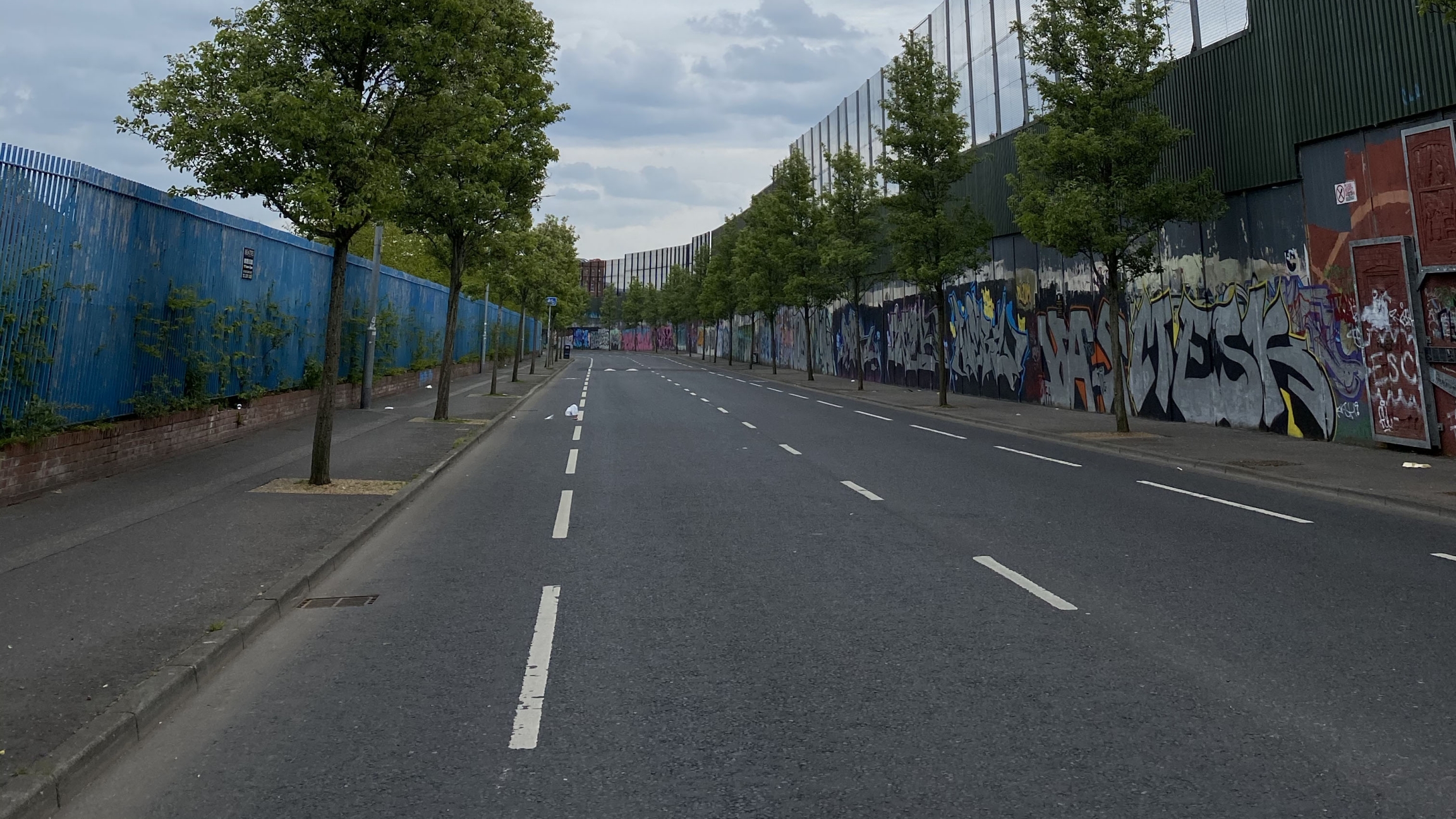 One of the so-called "peace walls" that divide Protestant and Catholic areas of west Belfast. One of the so-called "peace walls" that divide Protestant and Catholic areas of west Belfast.