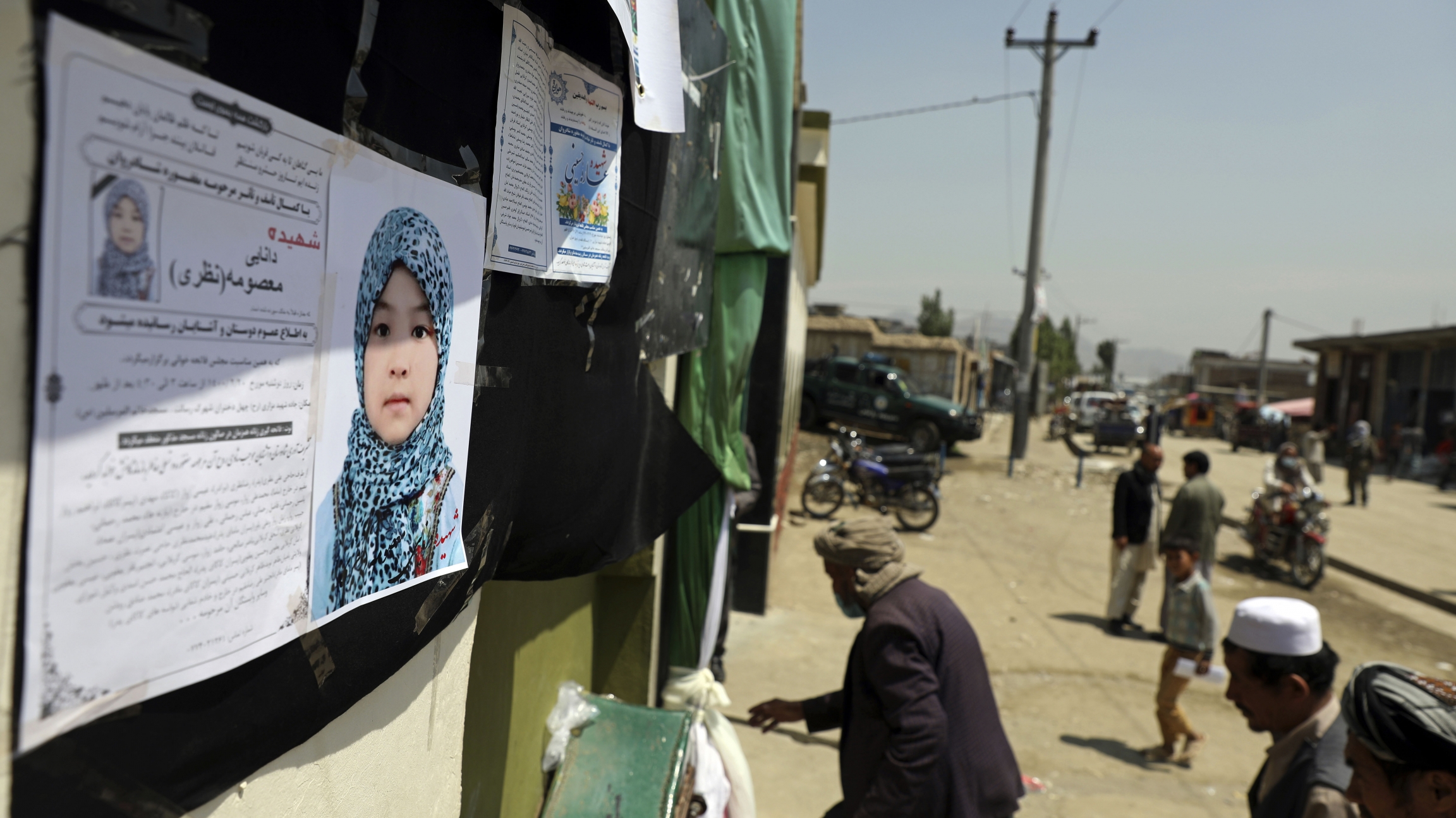 Afghans arrive at a memorial ceremony at a mosque in Kabul, Afghanistan for Masooma Nazari, a student who was killed by deadly bombings on Saturday near a school, May 10, 2021. Afghans arrive at a memorial ceremony for Masooma Nazari, a student who was killed by deadly bombings on Saturday.