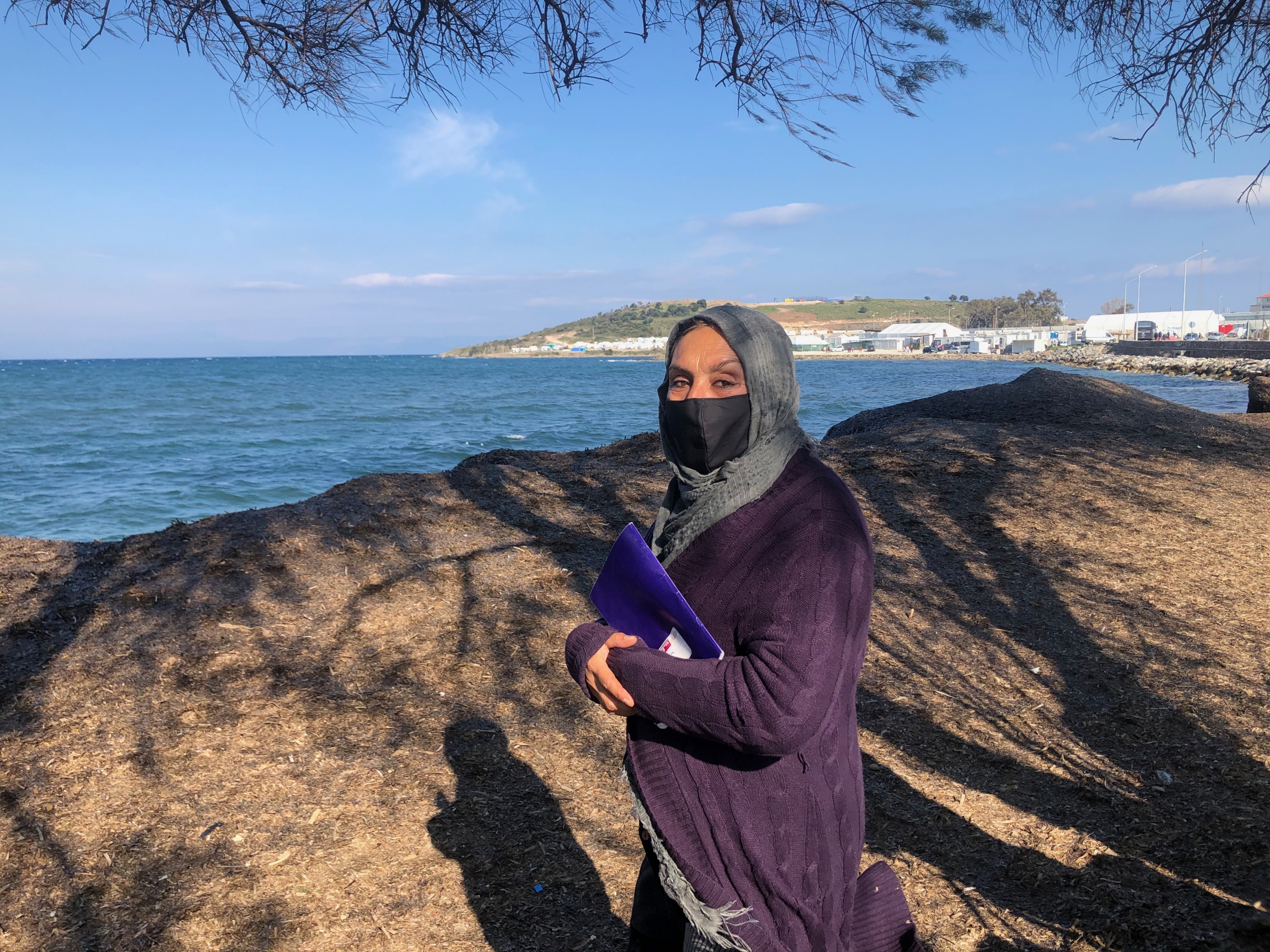 woman facing sea woman facing sea