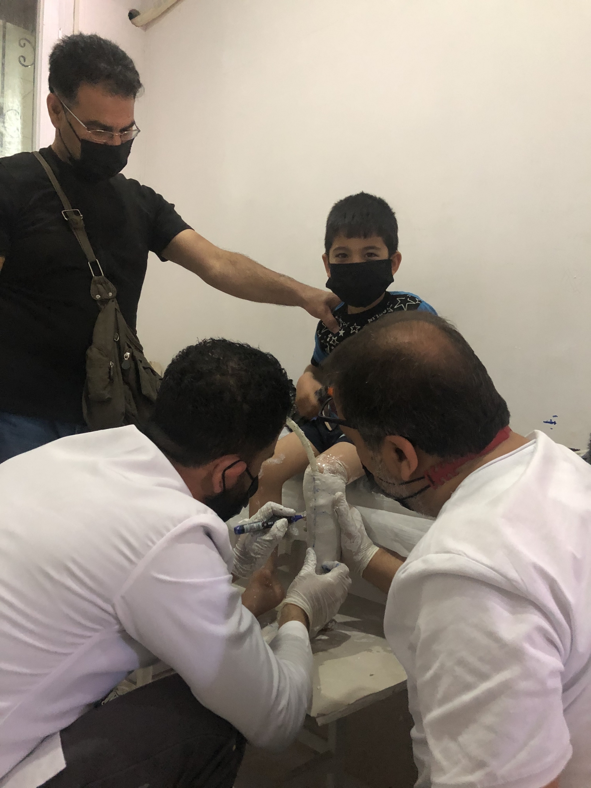 Mohamed al-Aweis (far left) said that his son, Jad, needed medical attention at birth but doctors urged him to leave immediately because there had been airstrikes nearby in recent days. Mohamed al-Aweis (far left) said that his son, Jad, needed medical attention at birth but doctors urged him to leave immediately because there had been airstrikes nearby in recent days.