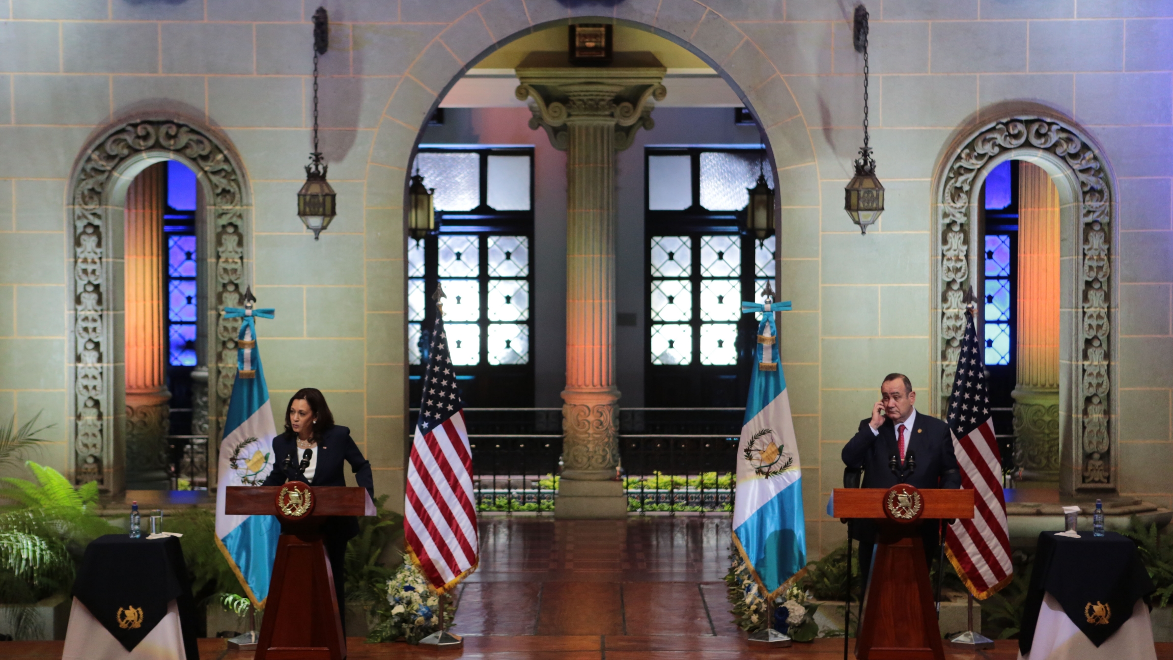 Vice President Kamala Harris, left, and Guatemalan President Alejandro Giammattei give a press conference at the National Palace in Guatemala City, Monday, June 7, 2021. Harris at the podium in Guatemala on a diplomatic visit