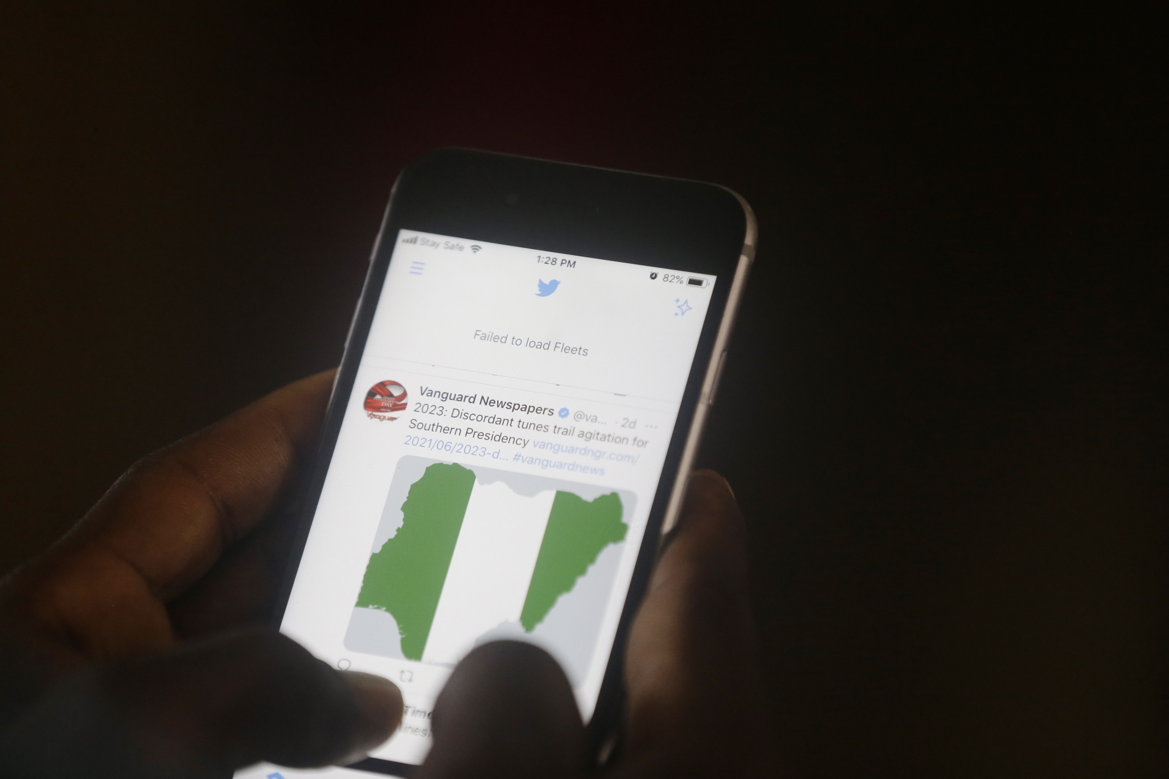 A man used his mobile phone to read headline news on Twitter inside an office in Lagos, Nigeria, Monday, June 7, 2021. A man used his mobile phone to read headline news on Twitter inside an office in Lagos, Nigeria, Monday, June 7, 2021.