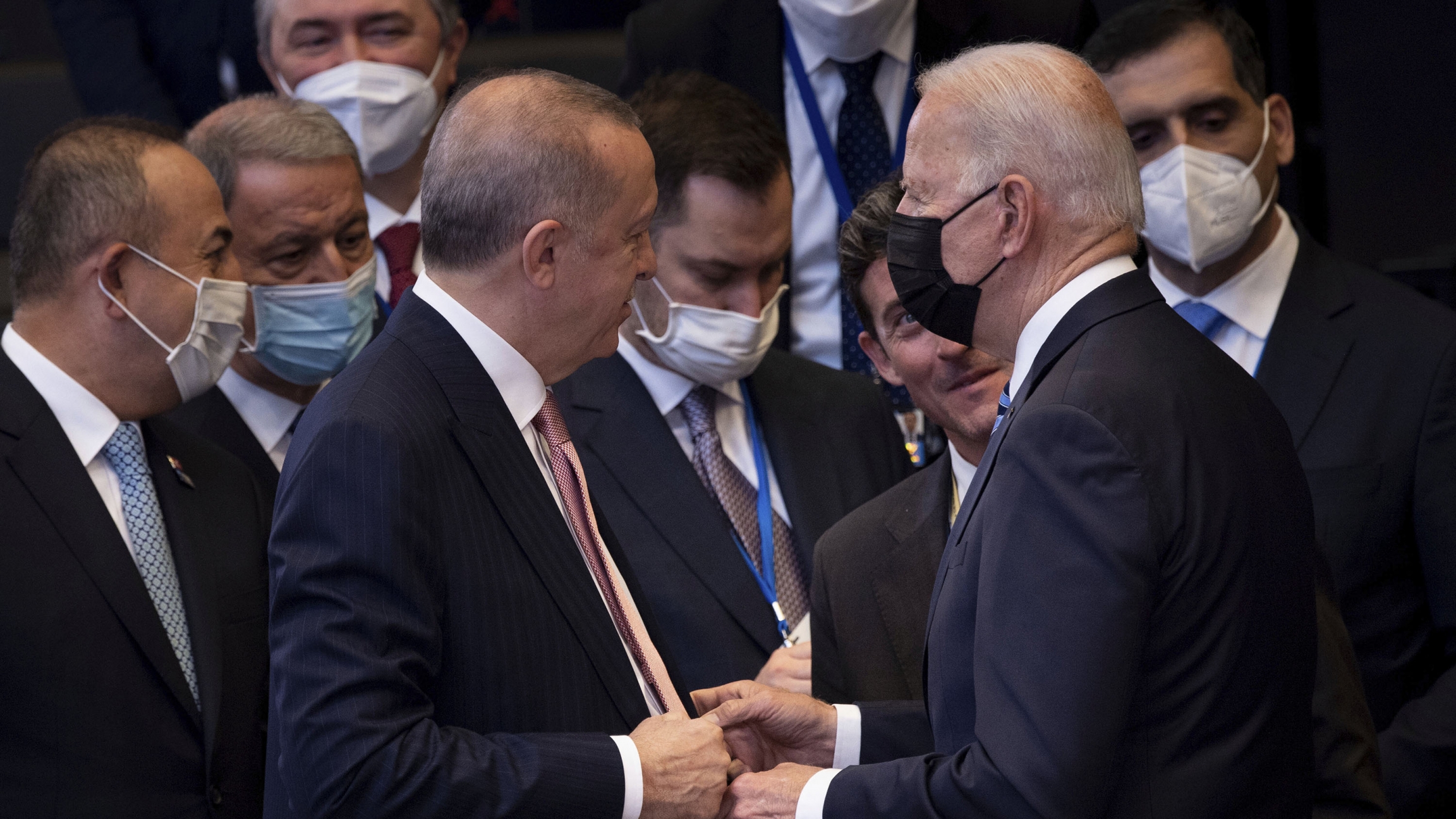 Turkey's President Recep Tayyip Erdoğan, center left, greets US President Joe Biden, center right, during a plenary session during a NATO summit at NATO headquarters in Brussels, Monday, June 14, 2021. Turkey's President Recep Tayyip Erdoğan, center left, greets US President Joe Biden, center right, during a plenary session during a NATO summit at NATO headquarters in Brussels, Monday, June 14, 2021.
