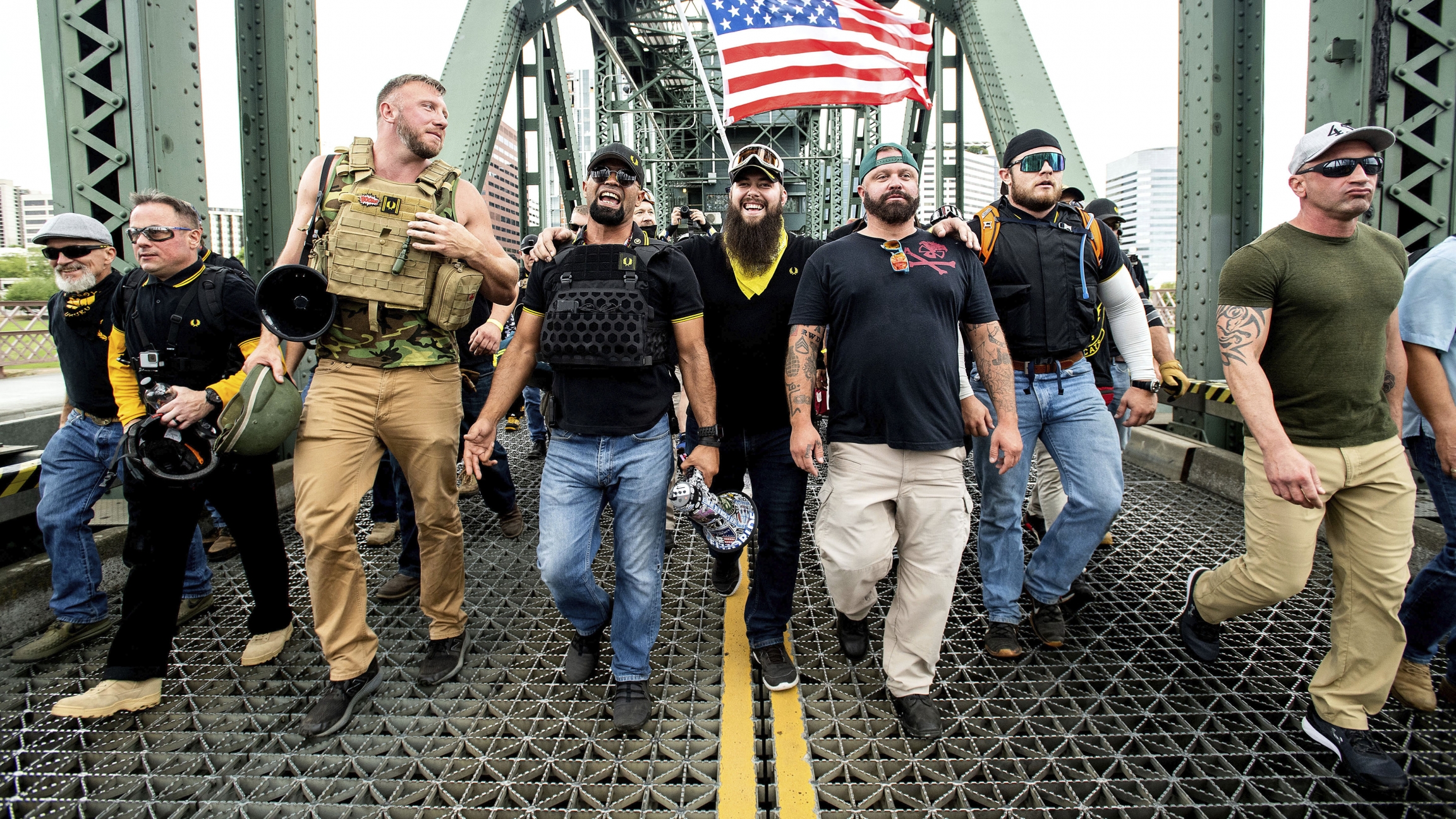 Members of the Proud Boys and other right-wing demonstrators march across the Hawthorne Bridge during an "End Domestic Terrorism" rally in Portland, Oregon, on Saturday, Aug. 17, 2019. Members of the Proud Boys and other right-wing demonstrators march across the Hawthorne Bridge during an "End Domestic Terrorism" rally in Portland, Oregon, on Saturday, Aug. 17, 2019.