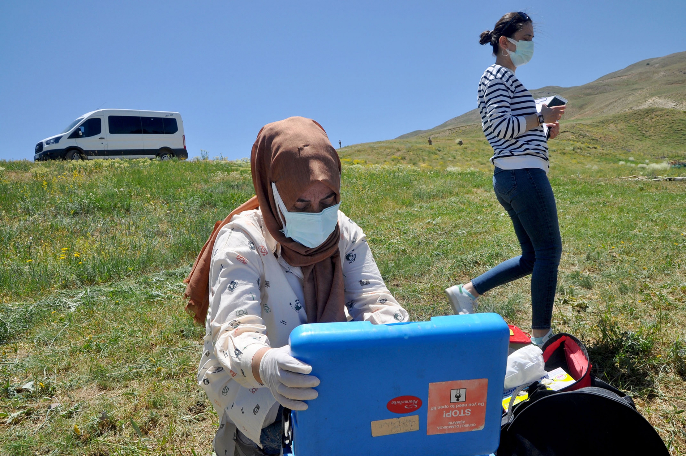 A health worker unloads equipment to vaccinate sheepherders in Ömerova, a village in Turkey’s eastern Kurdish region. A health worker unloads equipment to vaccinate sheepherders in Ömerova, a village in Turkey’s eastern Kurdish region.