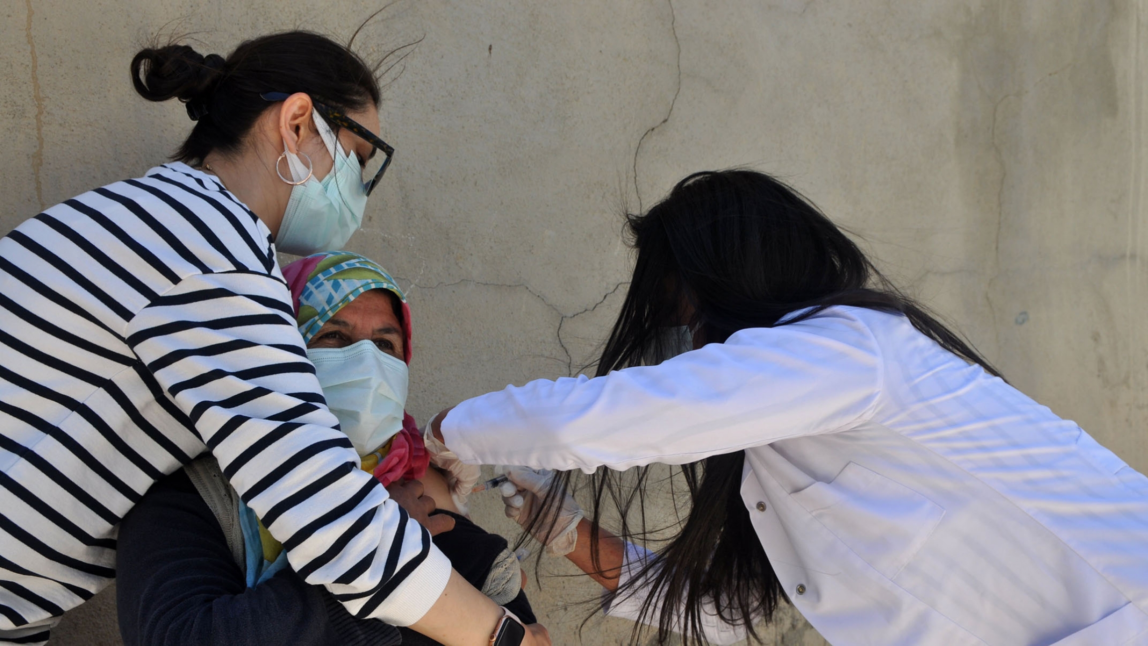 A patient receives a COVID-19 vaccine in the village of Ömerova. A patient receives a COVID-19 vaccine in the village of Ömerova.