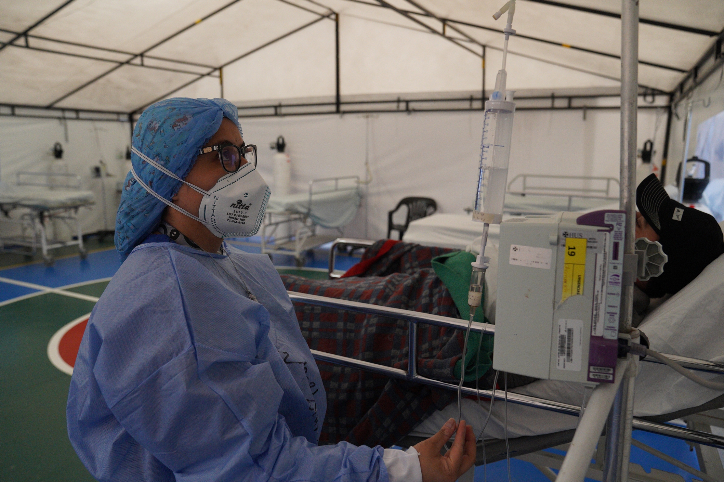 At the Samaritana hospital, the basketball court has been turned into a tent that can fit up to 12 patients. It's part of an effort to expand the ER's capacity as serious cases of COVID-19 rise. At the Samaritana hospital, the basketball court has been turned into a tent that can fit up to 12 patients. It's part of an effort to expand the ER's capacity as serious cases of COVID-19 rise.