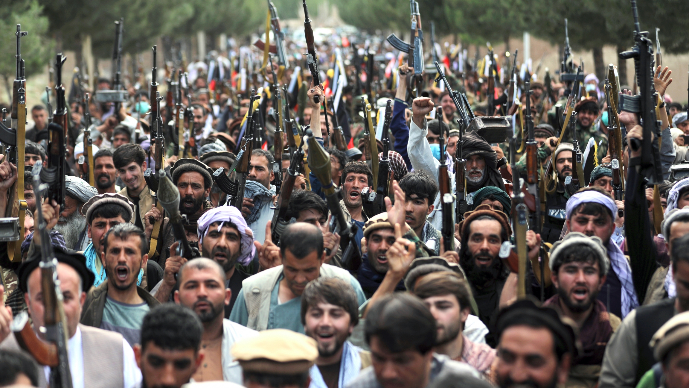 Afghan militiamen join Afghan defense and security forces during a gathering in Kabul, Afghanistan, June 23, 2021. Afghanistan's defense ministry is working with warlords to mobilize local militias across the country, most particularly in the north, to tr Afghan militiamen join Afghan defense and security forces during a gathering in Kabul, Afghanistan, June 23, 2021. Afghanistan's defense ministry is working with warlords to mobilize local militias across the country, most particularly in the north, to tr
