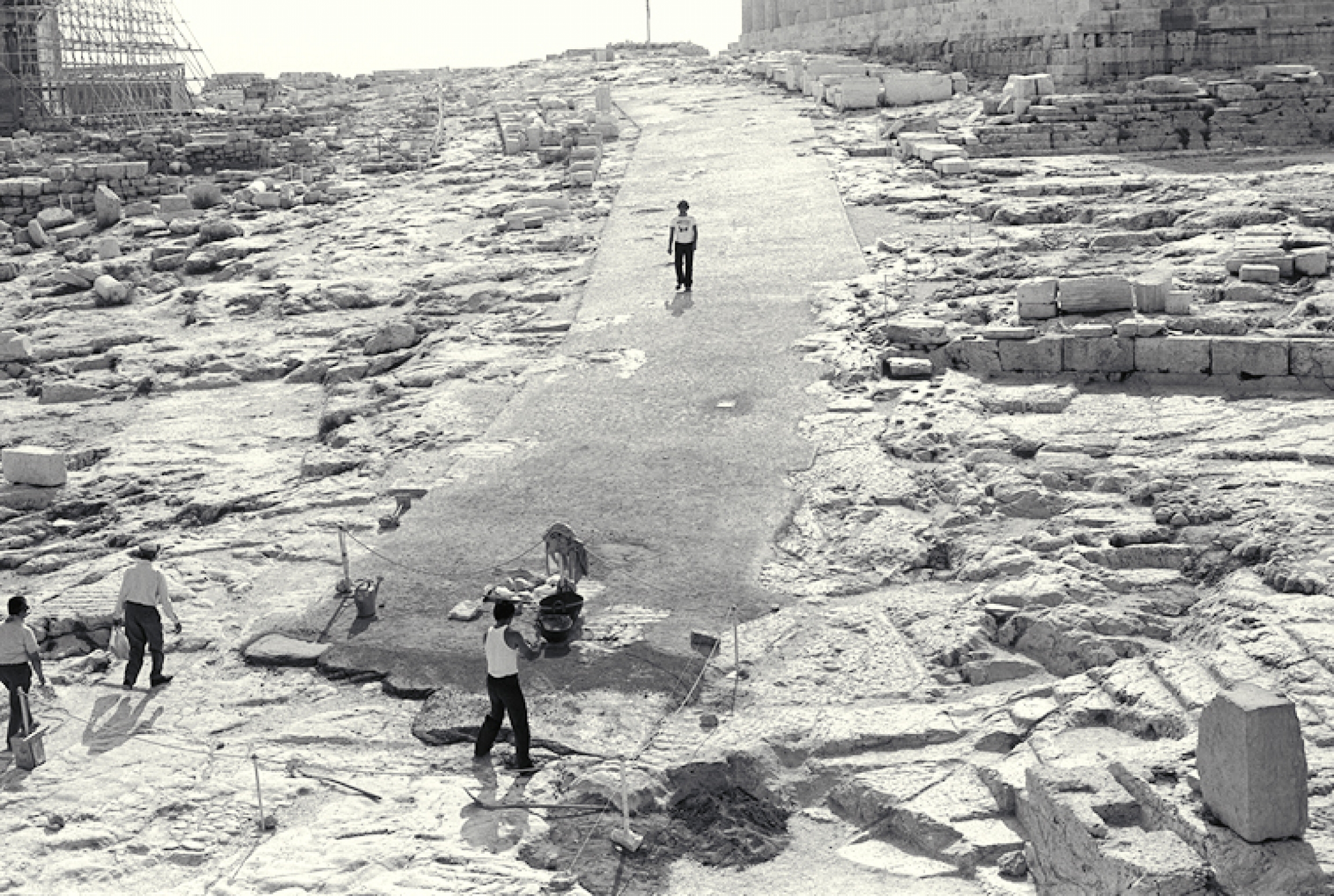 A previous iteration of a pathway on the Acropolis plateau, completed in 1977. Critics of the new walkway say its predecessor was more aesthetically fitting and was constructed with materials that allowed it to be removed without damaging the ancient bedr A previous iteration of a pathway on the Acropolis plateau, completed in 1977. Critics of the new walkway say its predecessor was more aesthetically fitting and was constructed with materials that allowed it to be removed without damaging the ancient bedr