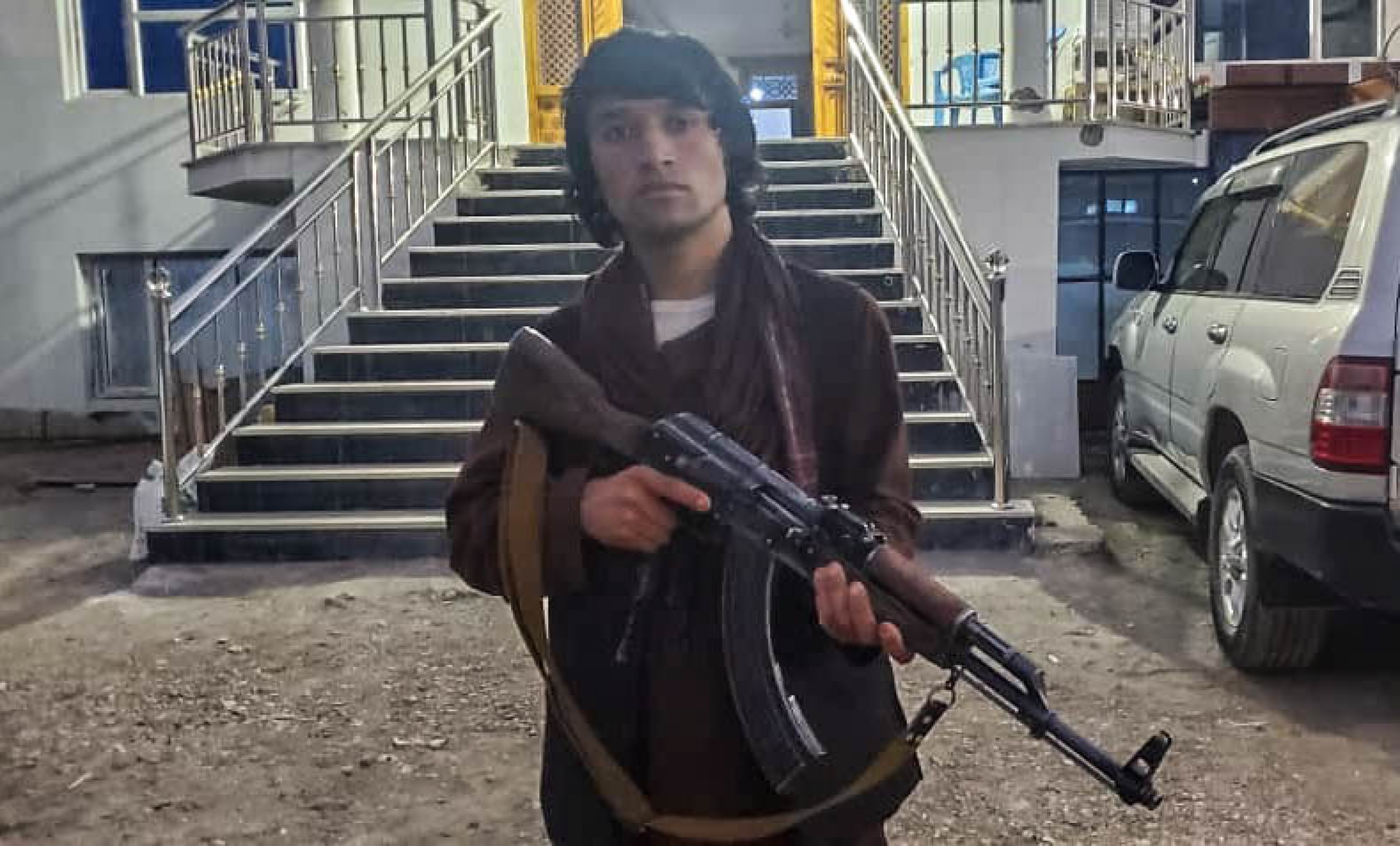 Twenty-year-old Safar Mohammad holds his AK-47 at a popular mobilization headquarter in Baghlan province in northern Afghanistan. Twenty-year-old Safar Mohammad holds his AK-47 at a popular mobilization headquarter in Baghlan province in northern Afghanistan.