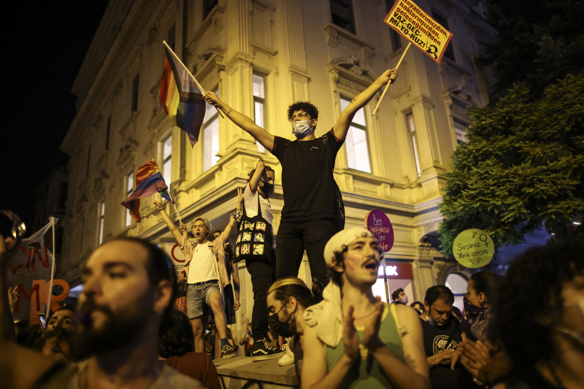 People chant slogans during a protest against the government's decision to withdraw from Istanbul Convention, in Istanbul, Thursday, July 1, 2021. People chant slogans during a protest against the government's decision to withdraw from Istanbul Convention, in Istanbul, Thursday, July 1, 2021.