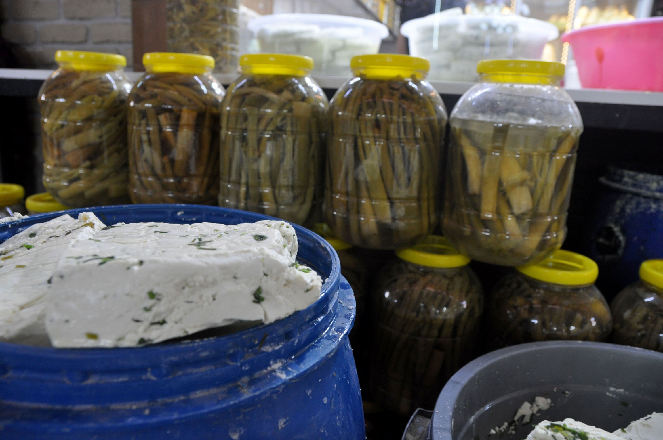 Plastic jugs of pickled wild herbs, used in local Van cheese, stand behind the star of the show. Plastic jugs of pickled wild herbs, used in local Van cheese, stand behind the star of the show.