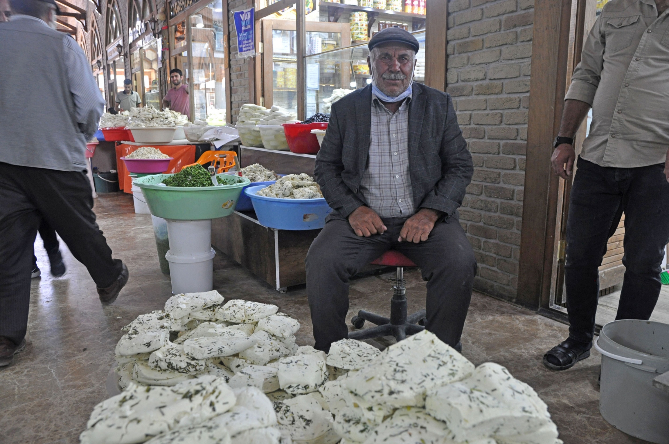 A cheese producer who gave just his first name, Islam, sits with 150 kilograms of Van Otlu Peyniri, a special regional cheese made with raw sheep’s milk and wild herbs. A cheese producer who gave just his first name, Islam, sits with 150 kilograms of Van Otlu Peyniri.