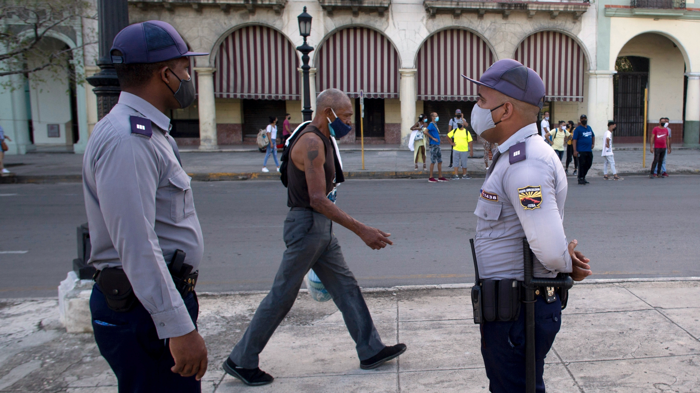 Police stand guard near the National Capitol building in Havana, Cuba, July 12, 2021, the day after protests against food shortages and high prices amid the coronavirus crisis. Police stand guard near the National Capitol building in Havana, Cuba, July 12, 2021, the day after protests against food shortages and high prices amid the coronavirus crisis.