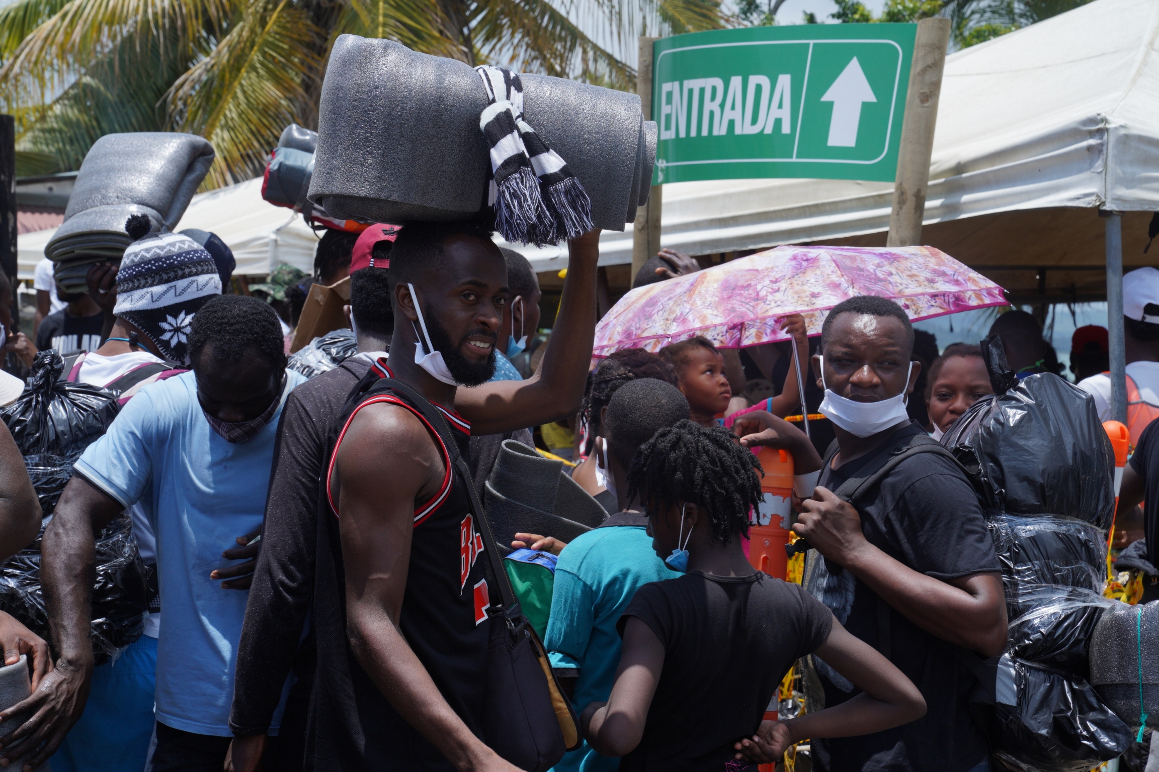 US bound migrants carry foam mattresses and wrap their luggage in garbage bags sealed with tape US bound migrants carry foam mattresses and wrap their luggage in garbage bags sealed with tape