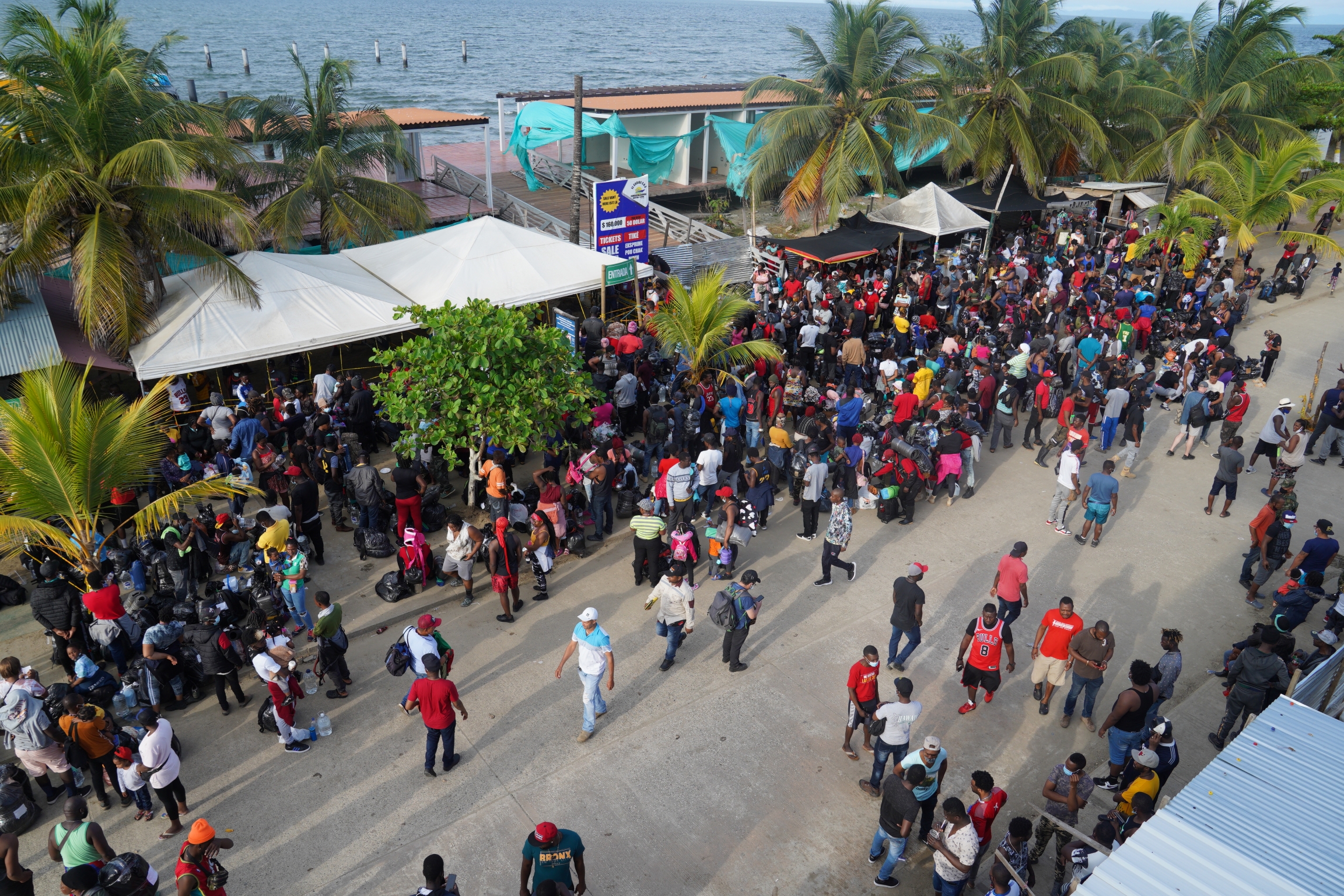Migrants headed towards Panama wait for boats in the town of Necocli, Colombia Migrants headed towards Panama wait for boats in the town of Necocli, Colombia