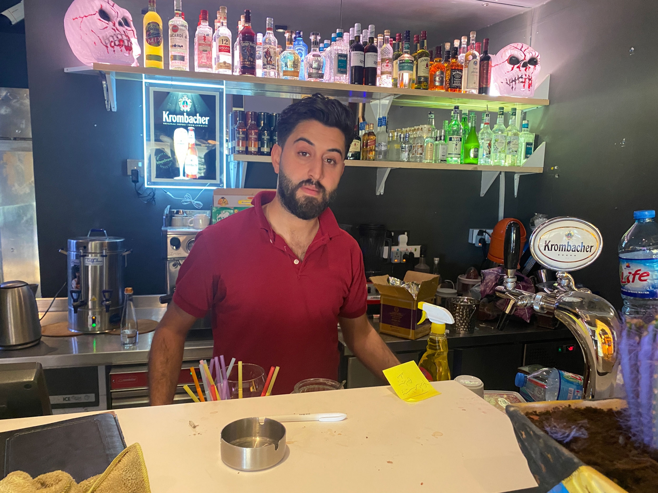 Mabast Zaman is a waiter at Senorita TexMex restaurant, Erbil, Iraq. Mabast Zaman is a waiter wearing a red shirt behind a bar at Senorita TexMex restaurant, Erbil, Iraq.