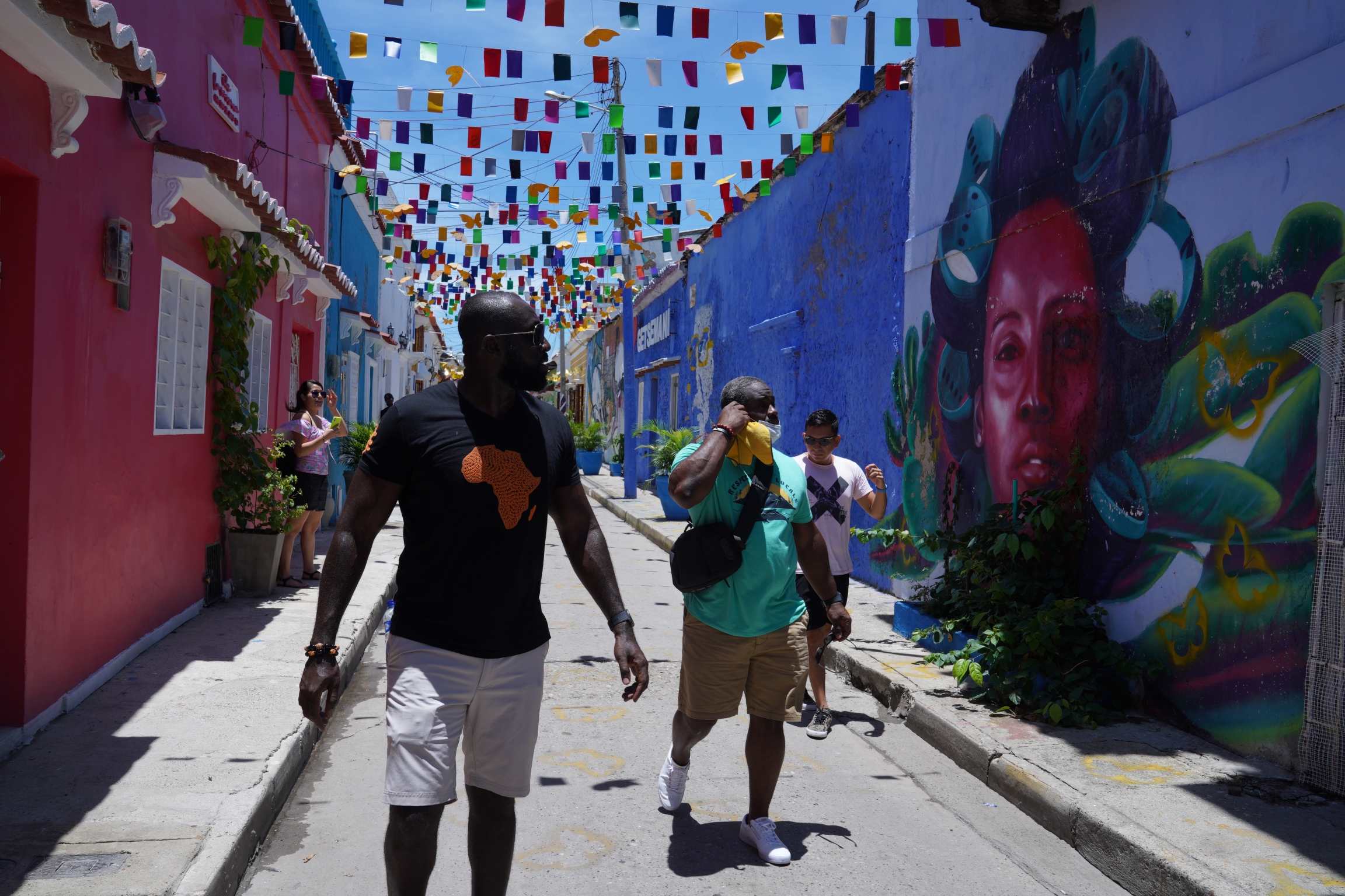 Tourists check out Getsemani. The neighborhood had a reputation from crime until recently, but investors have bought homes there and turned them into restaurants and boutique hotels Tourists check out Getsemani. The neighborhood had a reputation from crime until recently, but investors have bought homes there and turned them into restaurants and boutique hotels
