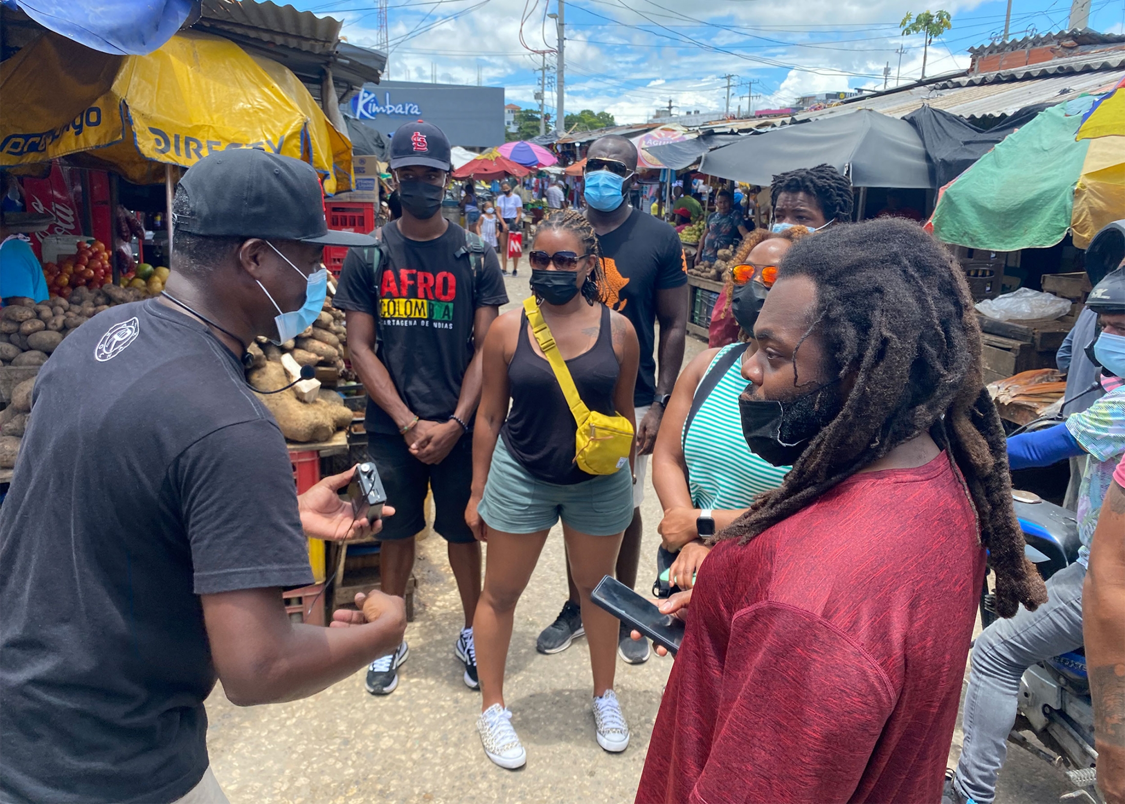 Rocha leads a group of tourists through Cartagena's Bazurto market, where many Afro-Colombians work as street vendors Rocha leads a group of tourists through Cartagena's Bazurto market, where many Afro-Colombians work as street vendors