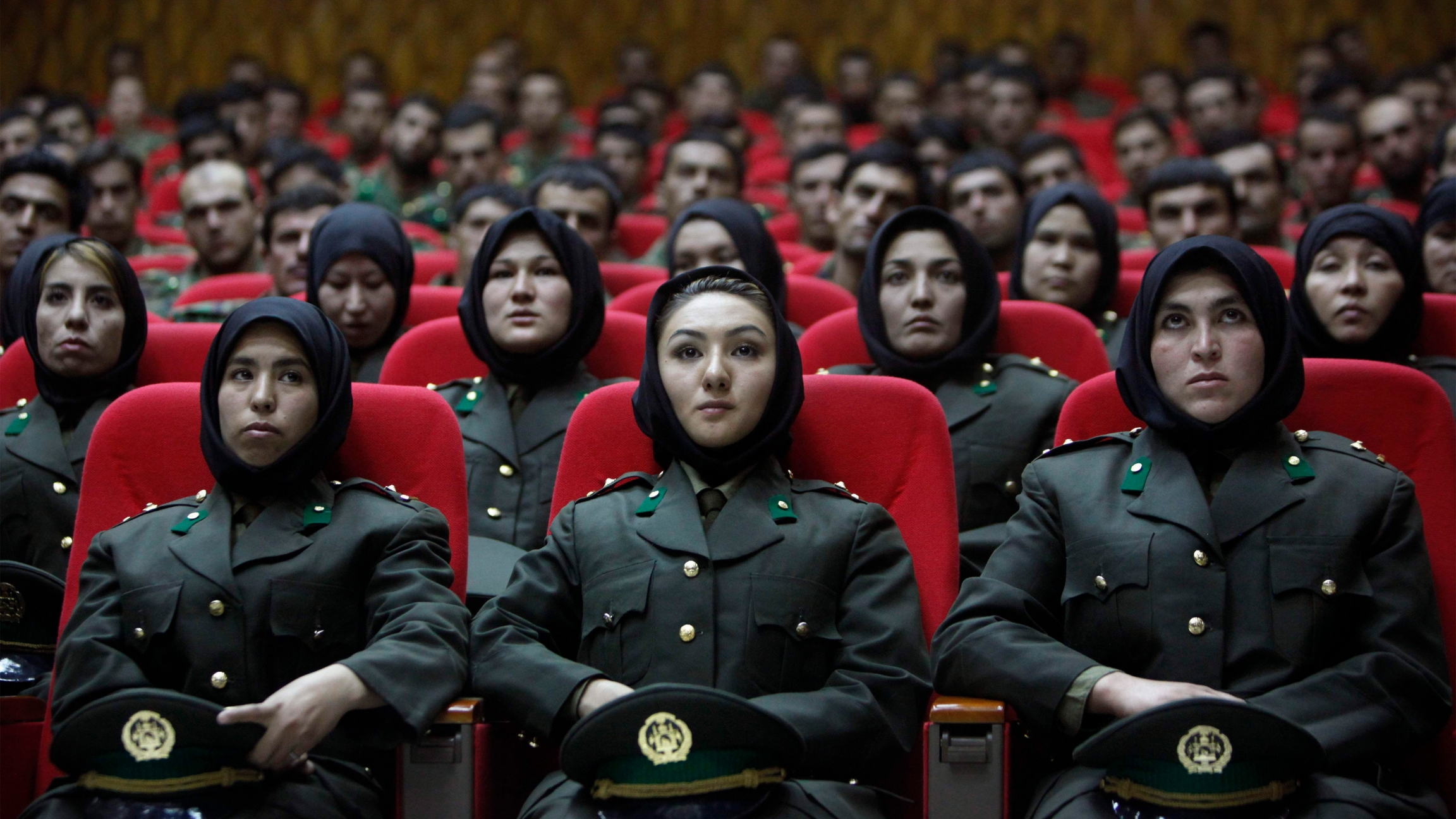 Newly trained female officers from the Afghan National Army sit in front seats as a new batch of officers attend their graduation ceremony at National Army's training center in Kabul on Sept. 23, 2010. Newly trained female officers from the Afghan National Army sit in front seats as a new batch of officers attend their graduation ceremony at National Army's training center in Kabul on Sept. 23, 2010.