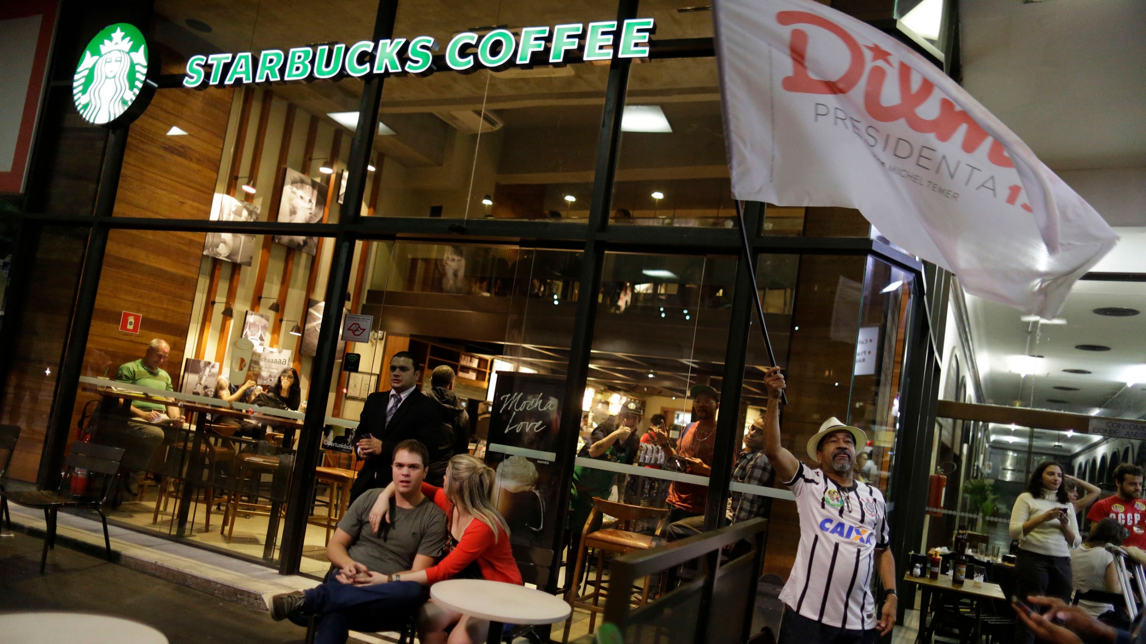 Brazilians gather in front of a Starbucks coffee shop in Sao Paulo, Brazil, Sunday, Oct. 26, 2014. Recent extreme weather events have taken a toll on Brazil's coffee crops, straining the global coffee supply chain. Brazilians gather in front of a Starbucks coffee shop in Sao Paulo, Brazil, Sunday, Oct. 26, 2014. Recent extreme weather events have taken a toll on Brazil's coffee crops, straining the global coffee supply chain.