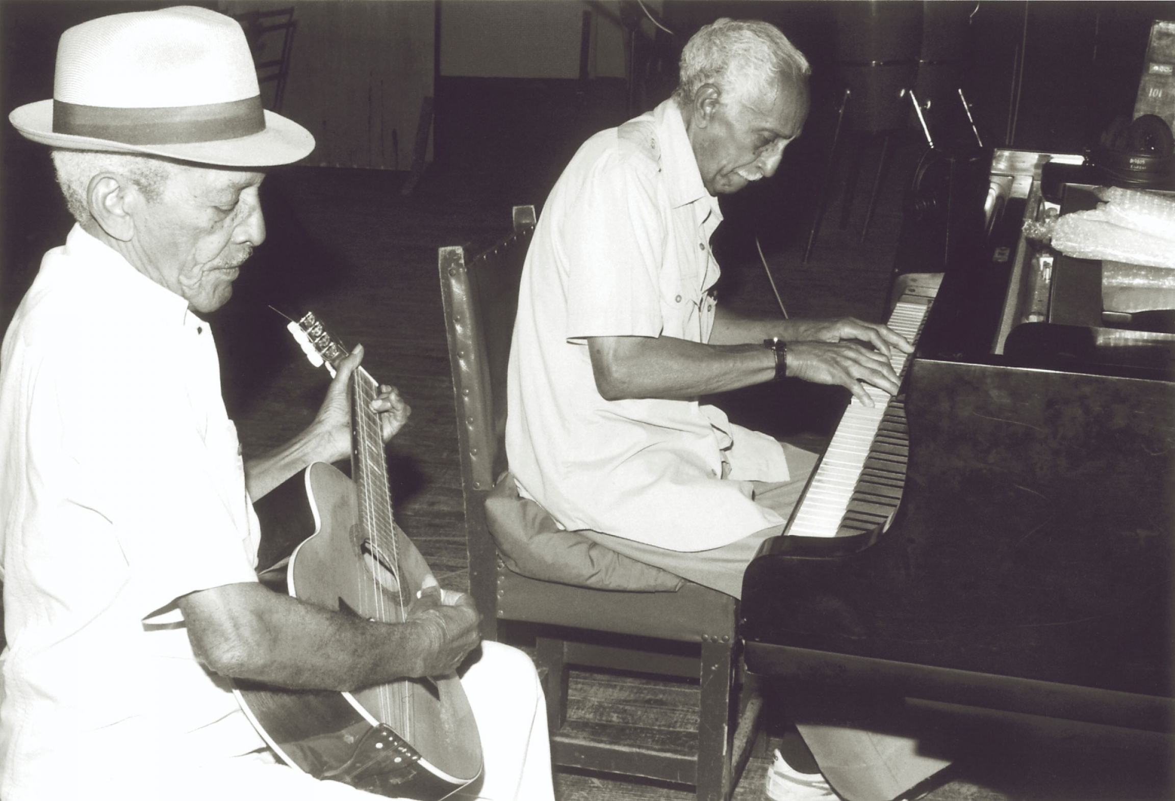 Compay Segundo and Rubén González rehearse together. Compay Segundo and Rubén González rehearse together.