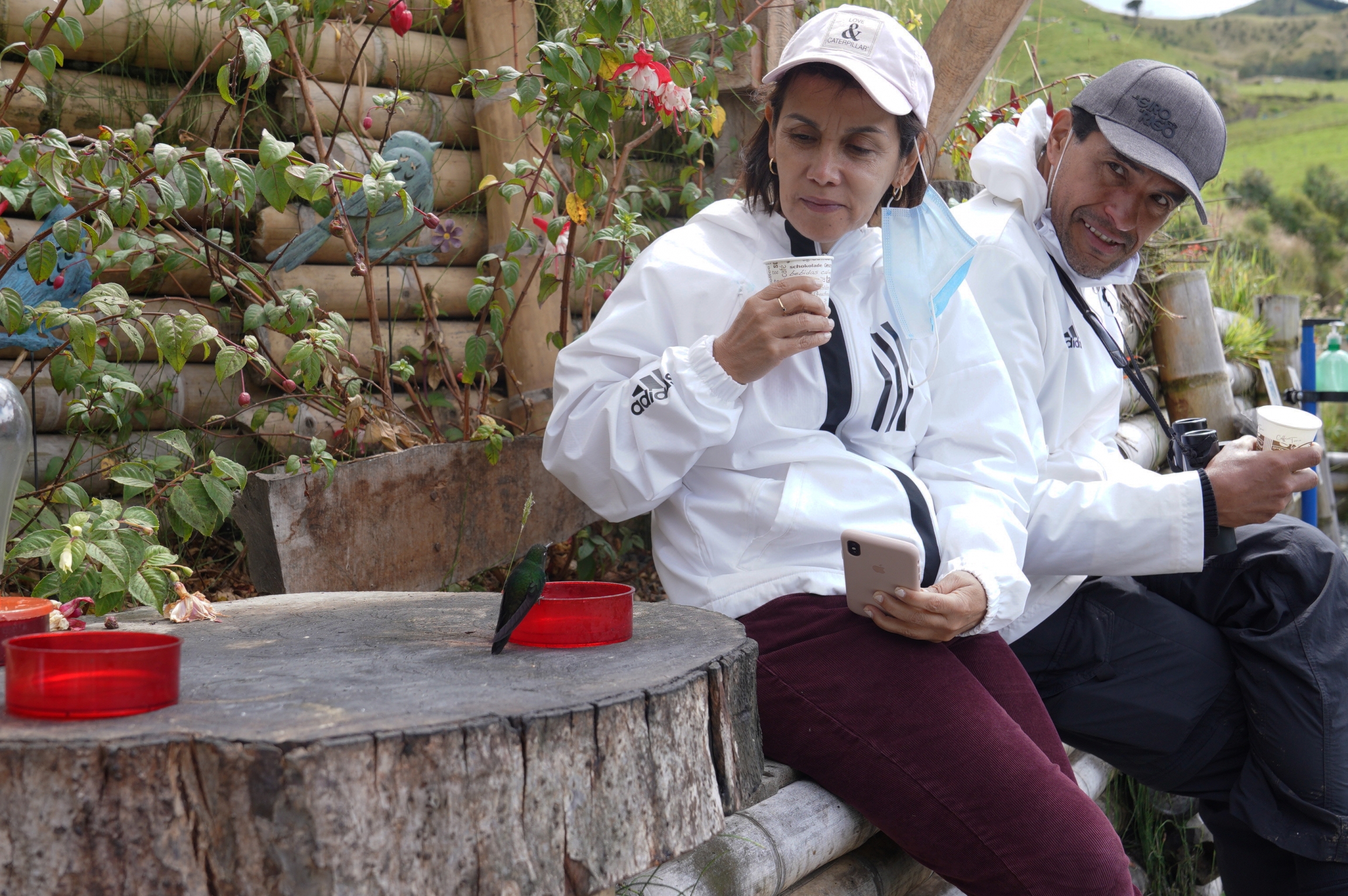 A tourist from Medellin Colombia gets up close with a hummingbird at Hacienda El Bosque. A tourist from Medellin Colombia gets up close with a hummingbird at Hacienda El Bosque.