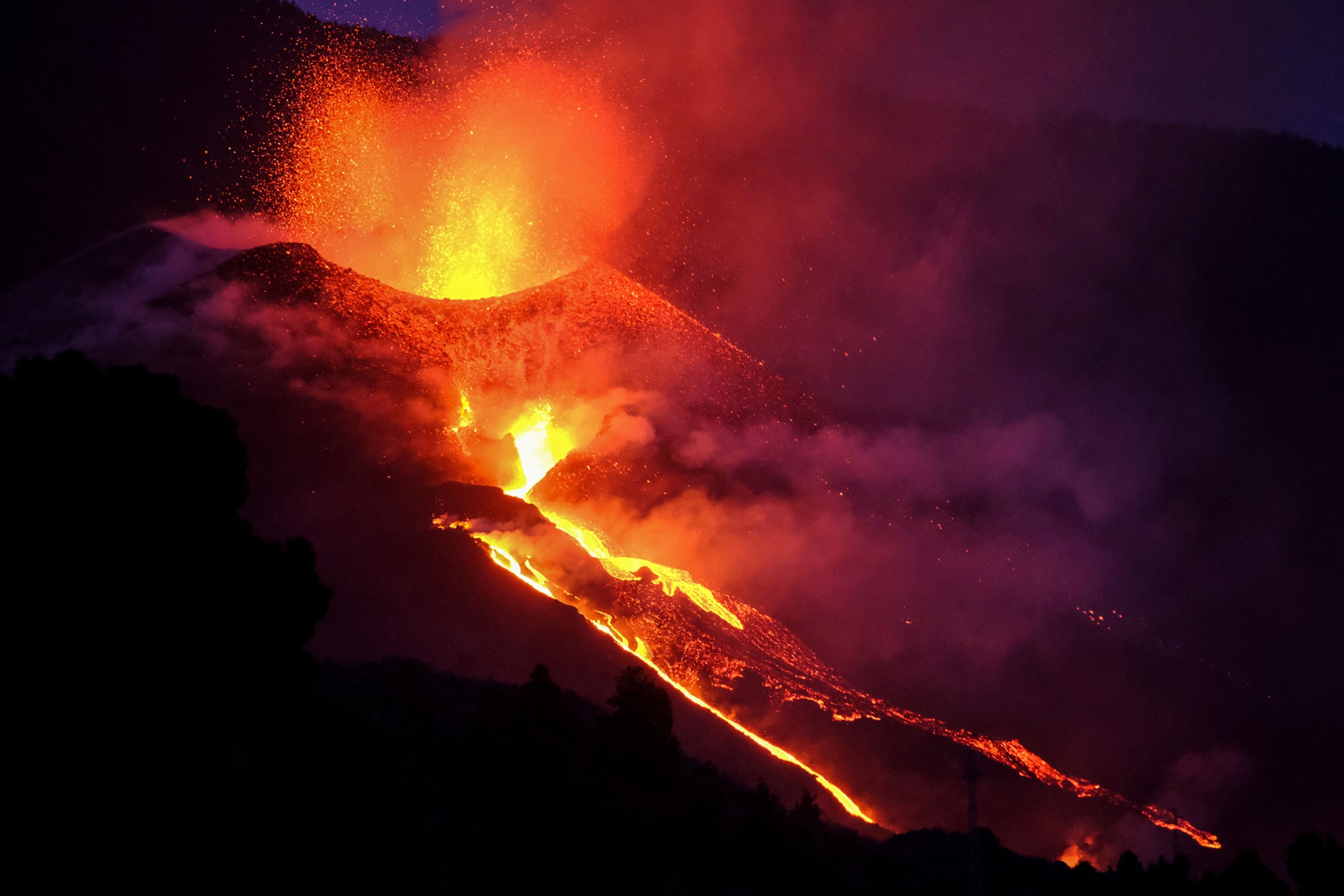 Lava flows from a volcano on the Canary island of La Palma, Spain, Saturday Oct. 2, 2021. Lava flows from a volcano on the Canary island of La Palma, Spain, Saturday Oct. 2, 2021.