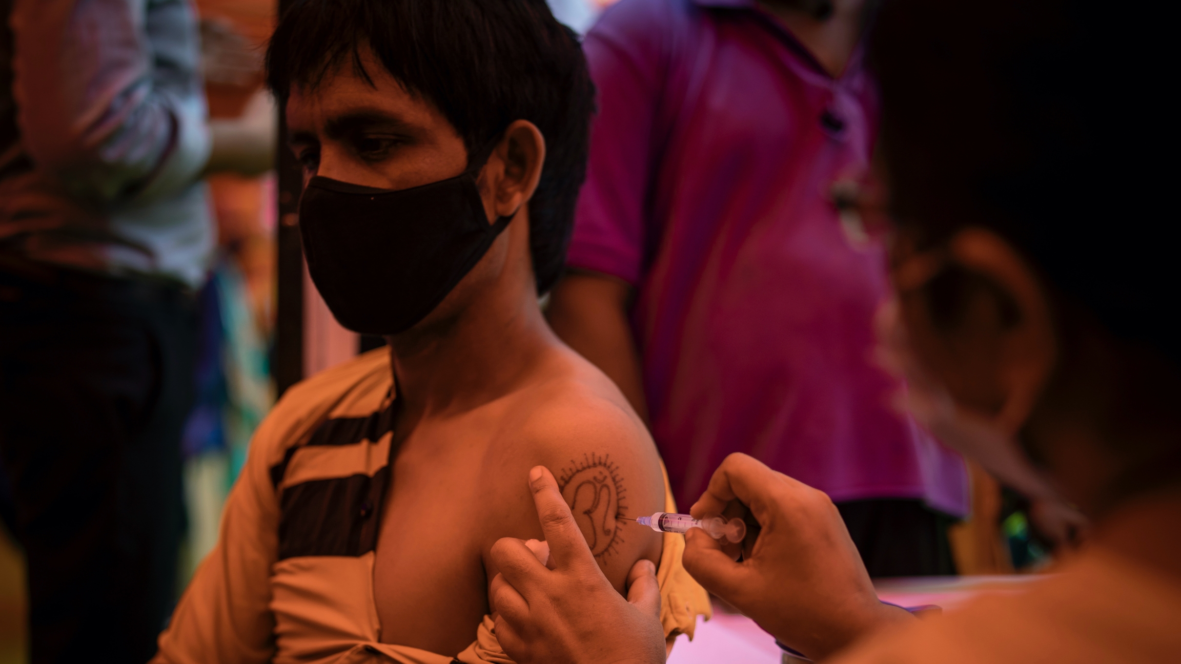A health worker inoculates a man during a vaccination drive against COVID-19 in Delhi, India, Sept. 29, 2021. India will soon roll out the world's first DNA vaccine. A health worker inoculates a man during a vaccination drive against COVID-19 in Delhi, India, Sept. 29, 2021. India will soon roll out the world's first DNA vaccine.