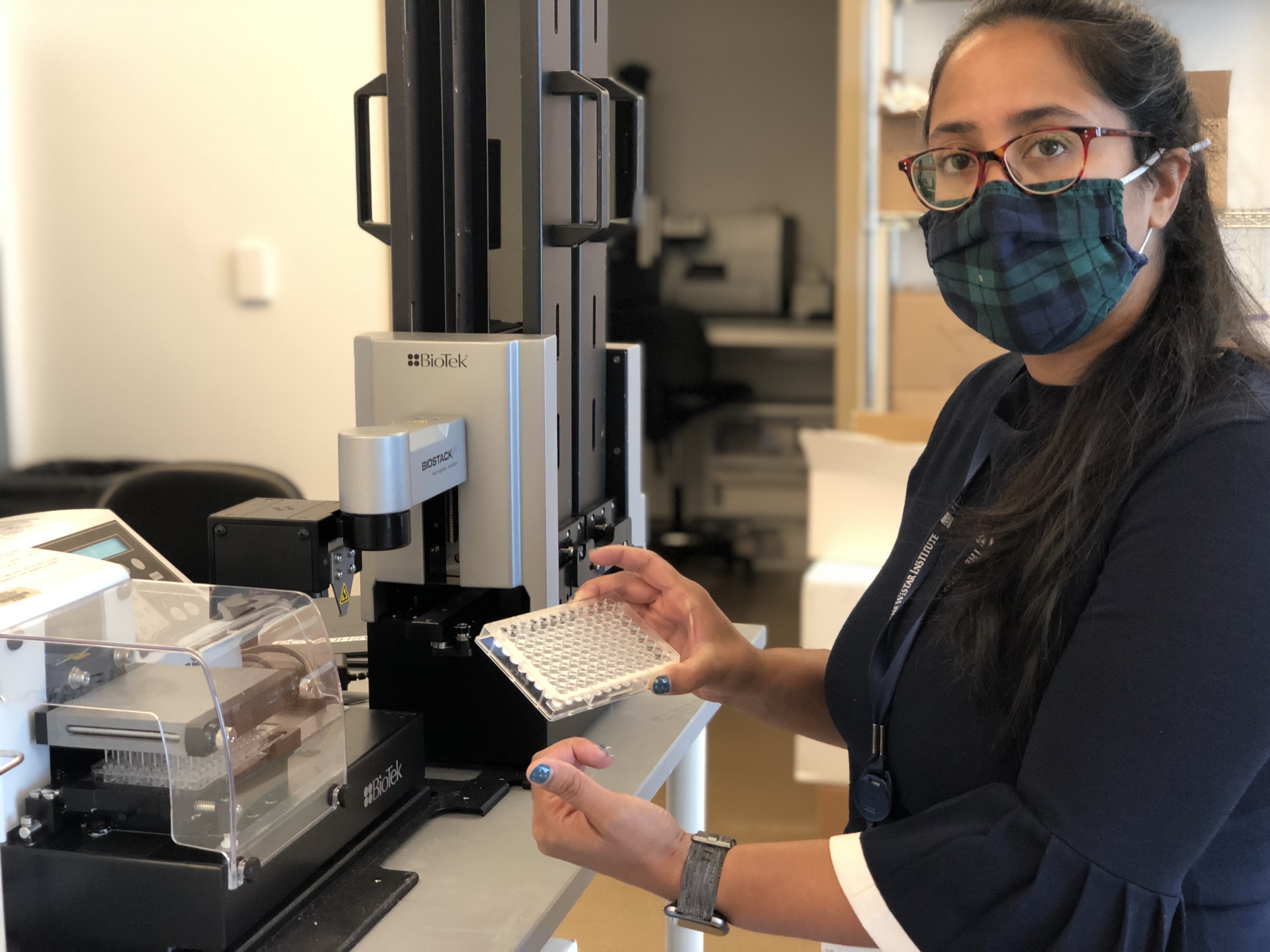 Ami Patel, a scientist at The Wistar Institute in Philadelphia, Pennsylvania, holds a “plate” used to test blood serum samples for antibodies from vaccines the lab is developing. One of them is for COVID-19. Ami Patel, a scientist at The Wistar Institute in Philadelphia, Pennsylvania, holds a “plate” used to test blood serum samples for antibodies from vaccines the lab is developing. One of them is for COVID-19.