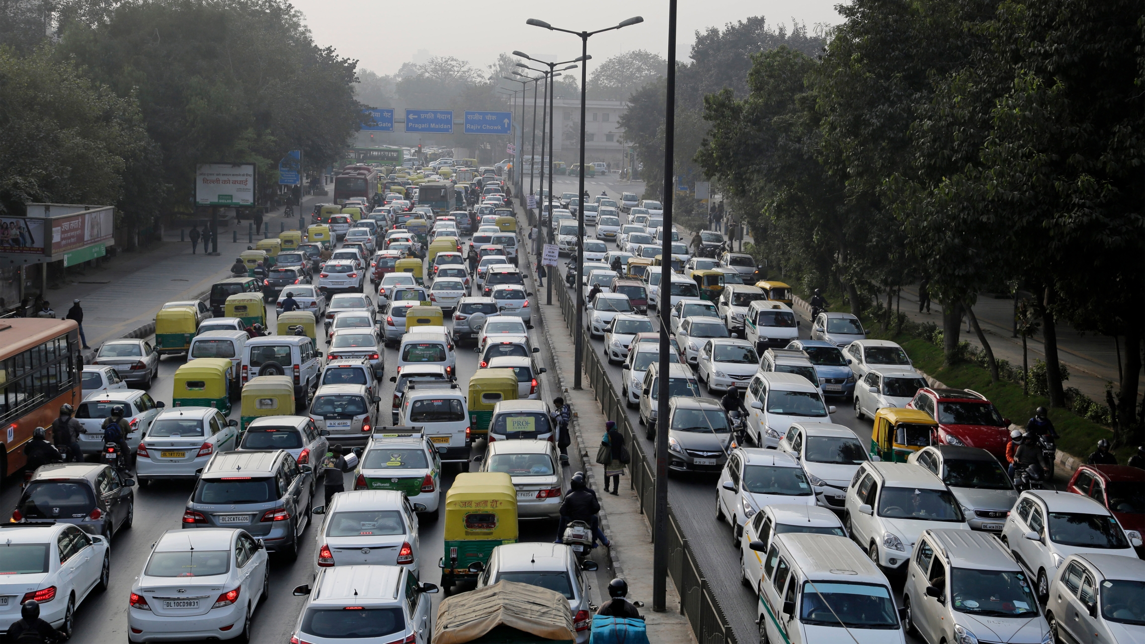 Vehicles move slowly through a traffic intersection after the end of a two-week experiment to reduce the number of cars to fight pollution in in New Delhi, India Vehicles move slowly through a traffic intersection after the end of a two-week experiment to reduce the number of cars to fight pollution in in New Delhi, India