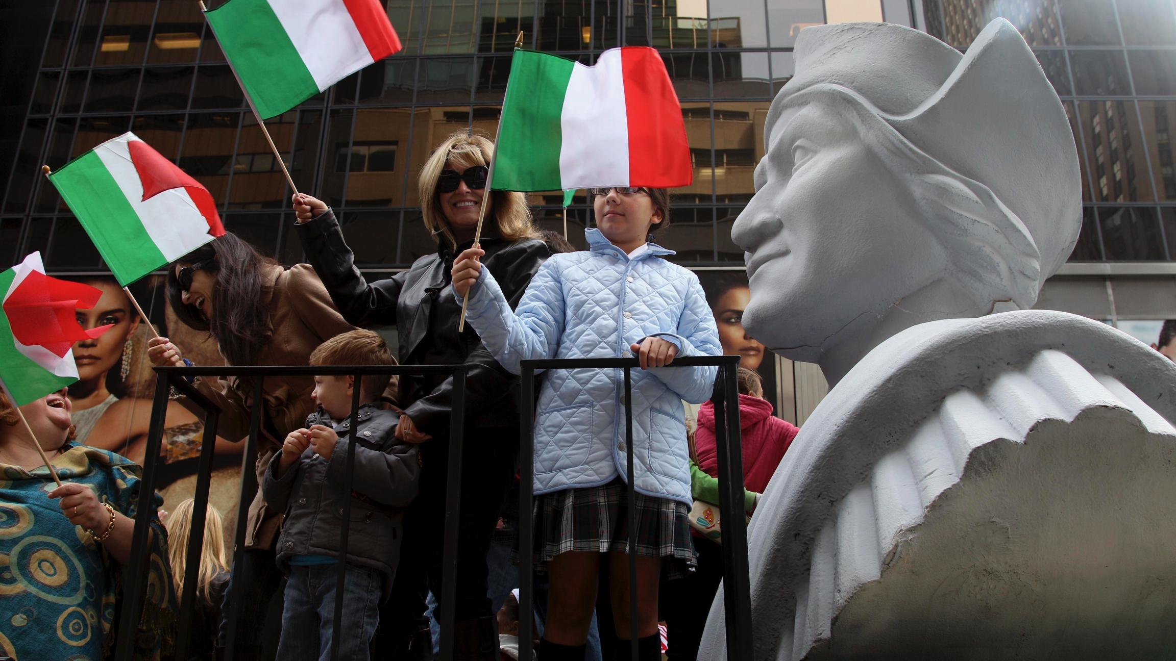 People ride on a float with a large bust of Christopher Columbus during the Columbus Day parade in New York, Oct. 8, 2012. The Oct. 12 federal holiday dedicated to Christopher Columbus continues to divide those who view the explorer as a representative of People ride on a float with a large bust of Christopher Columbus during the Columbus Day parade in New York, Oct. 8, 2012. The Oct. 12 federal holiday dedicated to Christopher Columbus continues to divide those who view the explorer as a representative of