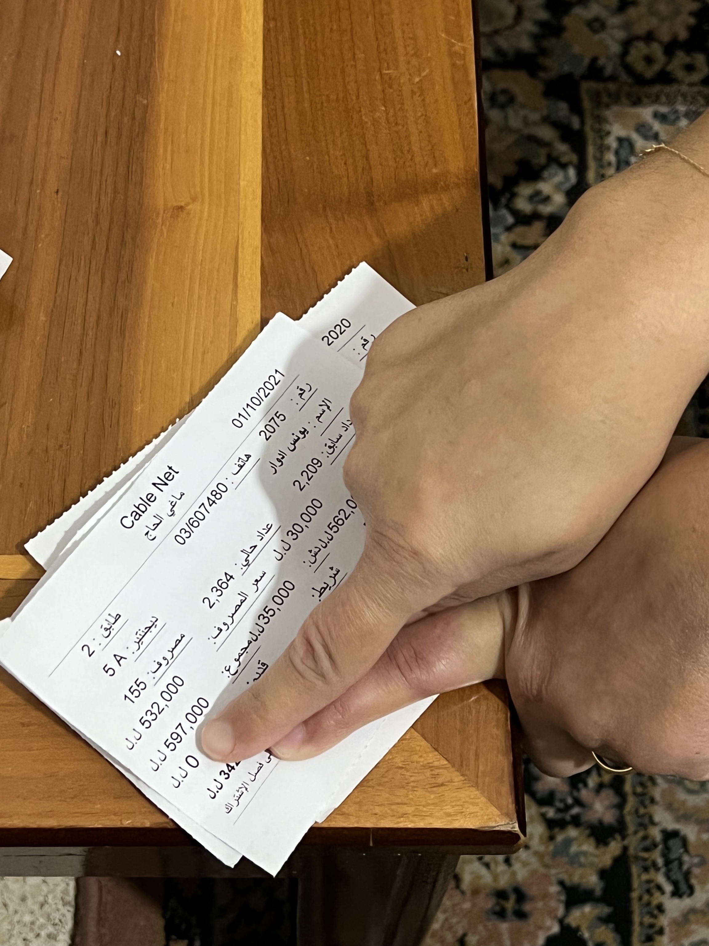 Beirut resident Diala Attieh Younes shows her generator bills. She paid about 600,000 lira last month. This is while she lost her job as a teacher at the beginning of the pandemic. Beirut resident Diala Attieh Younes shows her generator bills. She paid about 600,000 lira last month. This is while she lost her job as a teacher at the beginning of the pandemic.