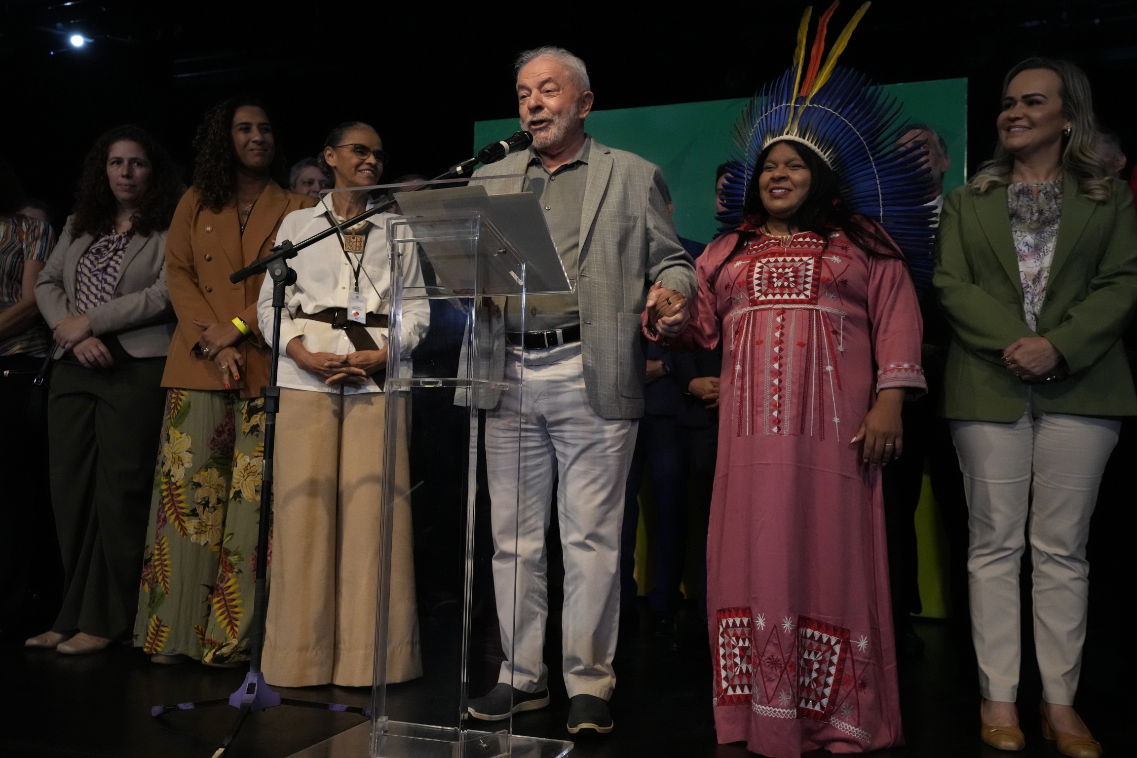Brazil's President-elect Luiz Inacio Lula da Silva holds the hand of the his newly-named Minister of Indigenous Peoples Sonia Guajajara