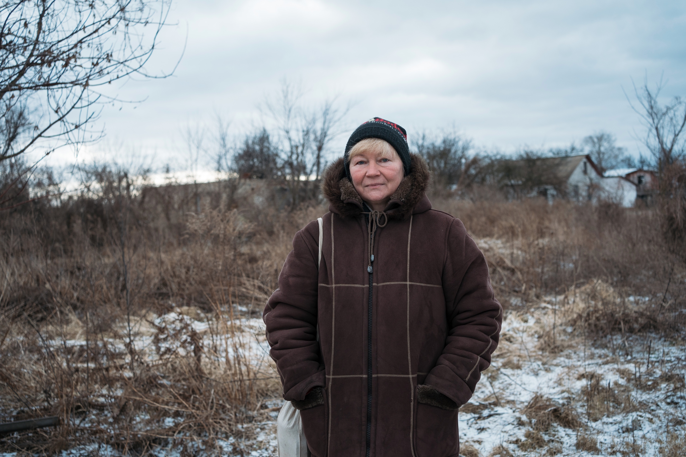 woman in front of field