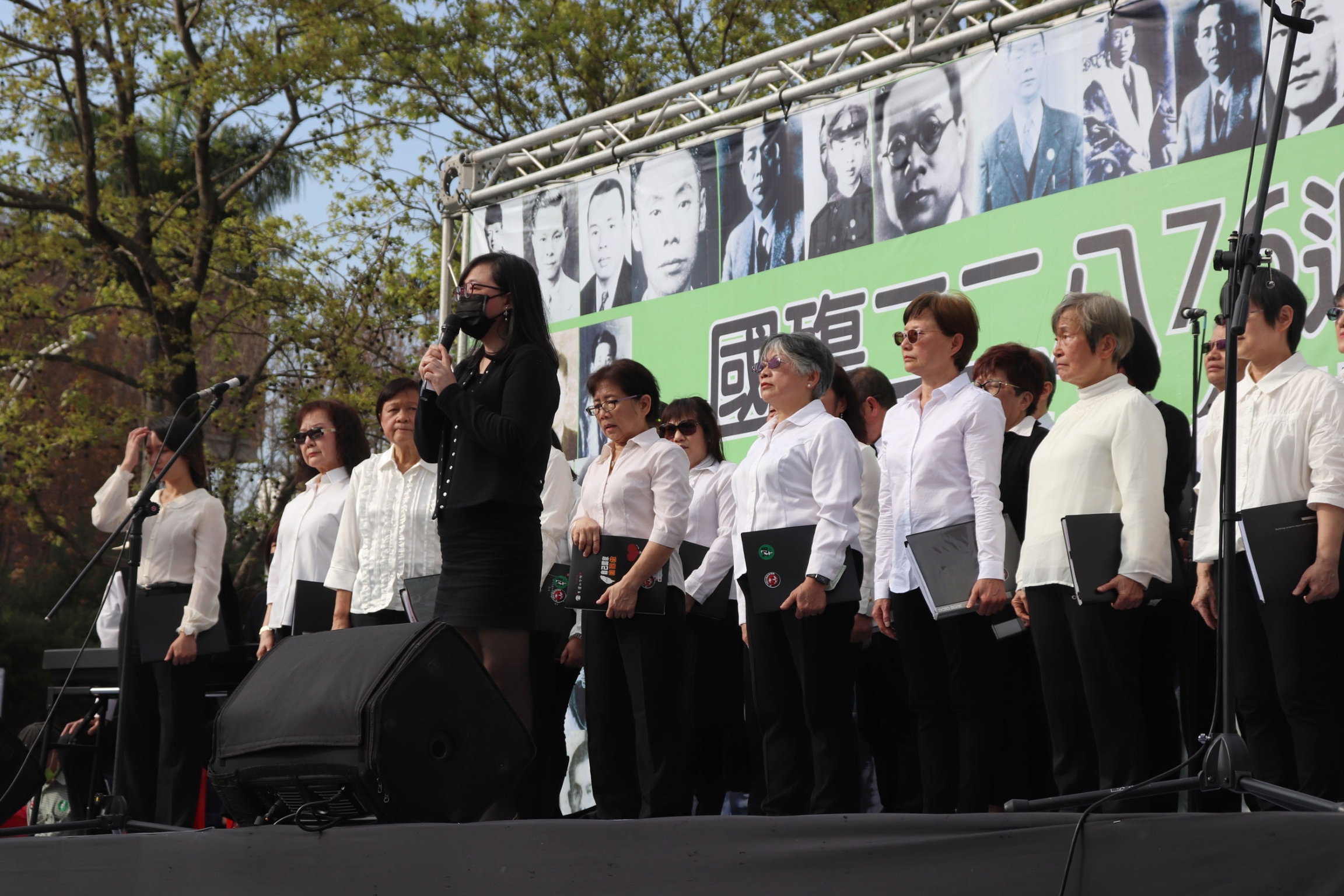 Amy Lee speaks at a 228 memorial event in front of the Chiang Kai-Shek memorial hall. 