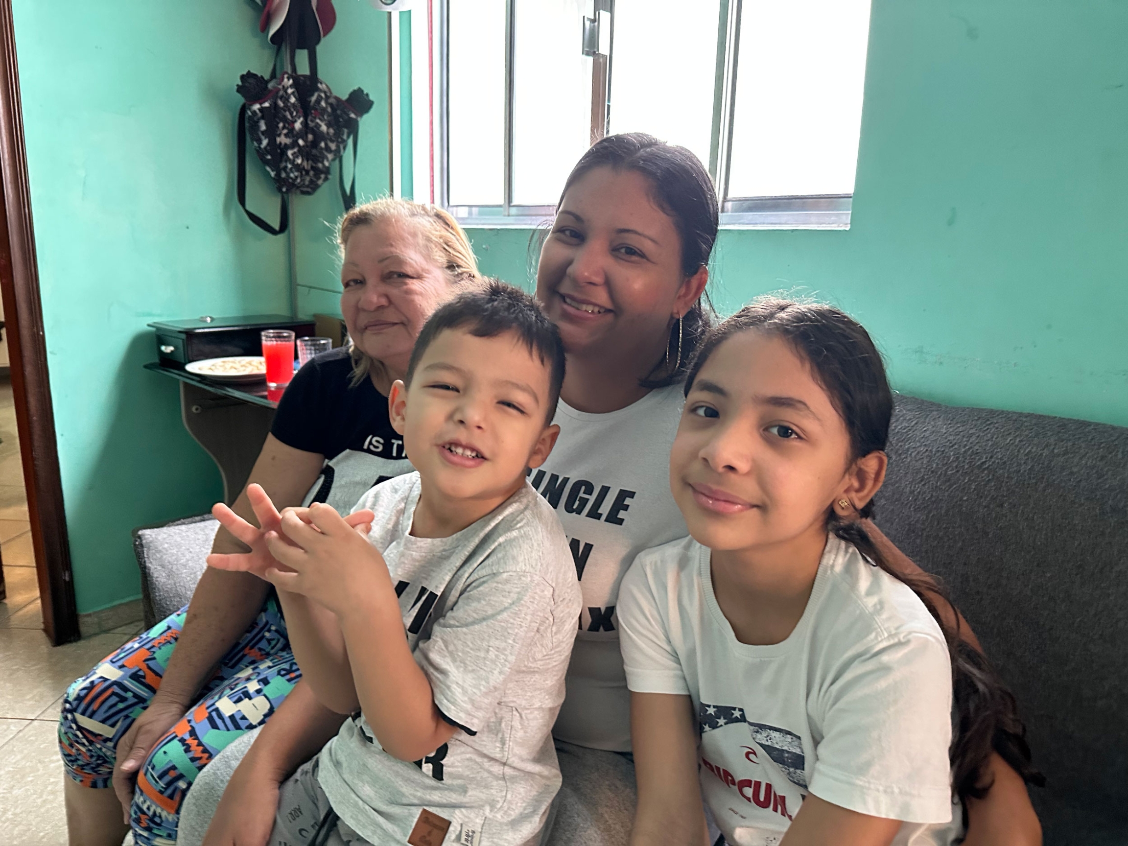 Yoselin Calcurian (center) with her youngest son Josué, 4, and daughter Sofia, 9. Her mother (left) was visiting them from Venezuela. 