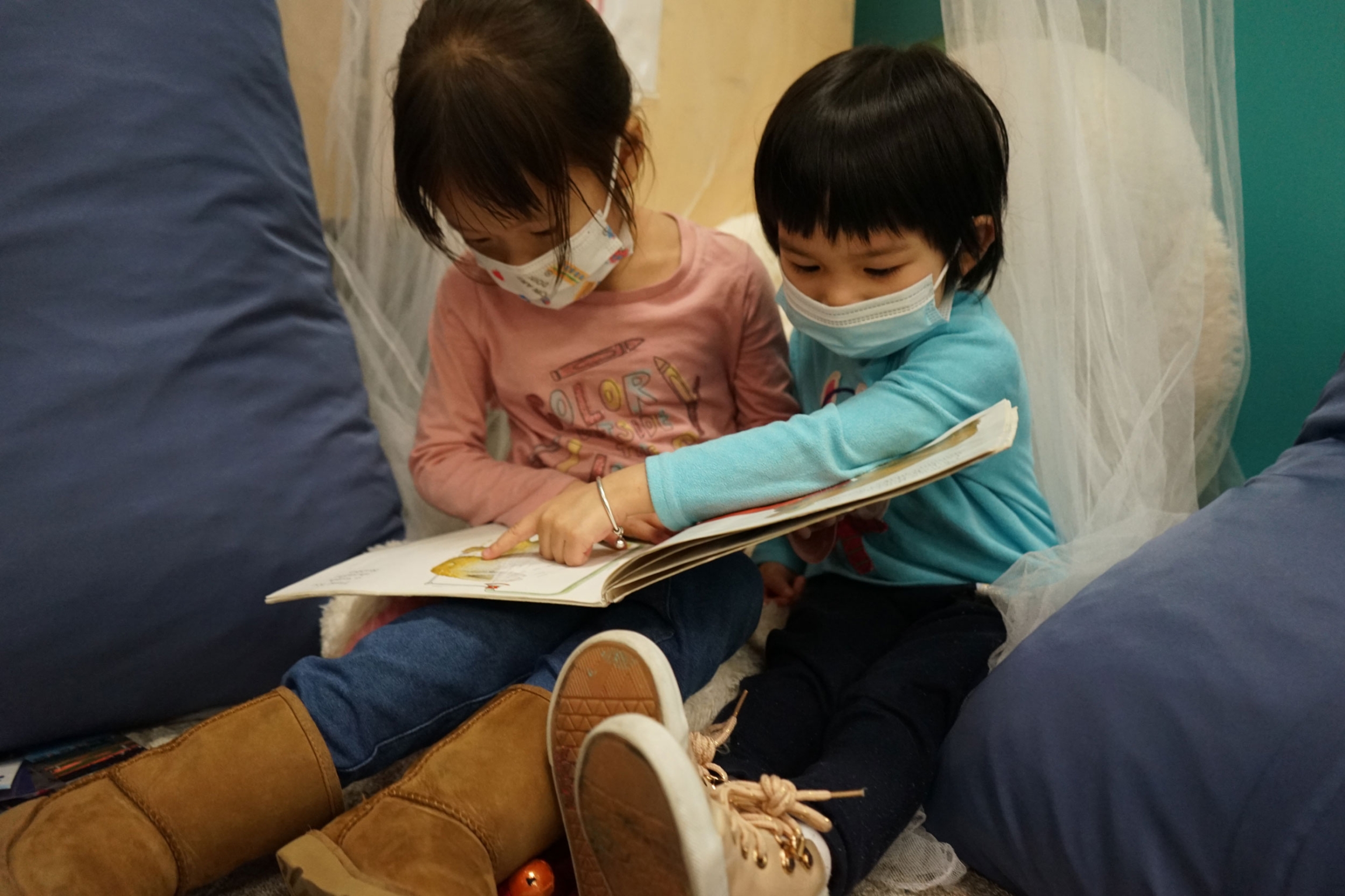 In the conflict resolution corner, children reconcile with each other when there has been a disagreement. 
