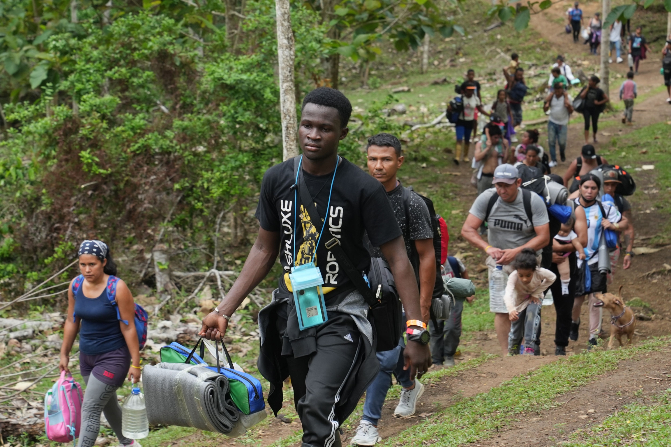 A group of migrants from Burkina Faso, Haiti and Venezuela start the three day long trek across the rainforest. 